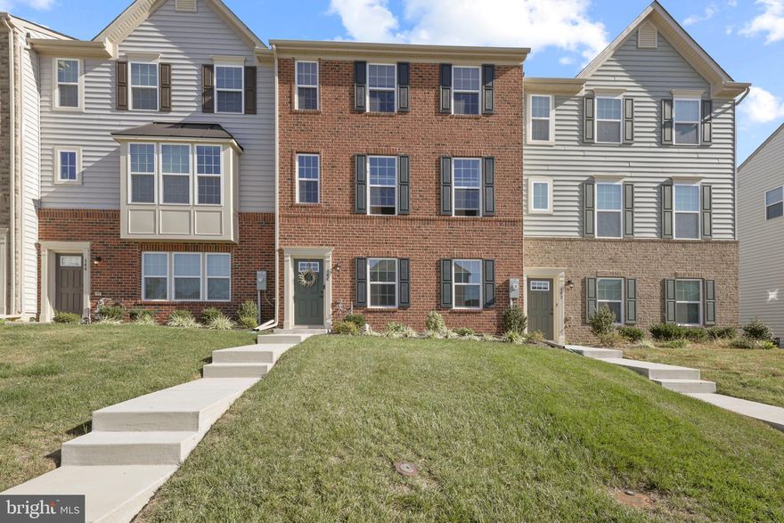 Luxury brick front 3 bedroom 2 1/2 bath townhome, with a 2 car garage in beautiful Greenway Farms in Havre de Grace. This home features 3 completely finished levels to serve your family's needs. The main living area features dark hardwood flooring throughout, crown molding in the living room, and a powder room. The gourmet kitchen features stainless steel appliances, granite counter tops, a huge center island that provides ample space for preparing large meals, 42" cabinets, recessed lighting, beautiful pendant lighting fixtures, and access to you 20x12 composite rear deck. The adjoining dining area compliments the kitchen with hardwood flooring and a pantry. The upper level features the primary bedroom with a private bathroom suite, including a double vanity and ceramic tile spacious shower. The laundry area is conveniently located on the upper level as well as a ceramic tile hall bath. The entry level offers a finished office/play room (or whatever you want to use it for) with laminate flooring. A separate stairway from the garage to the main stairs provides entry without needing to  go through the office area. You're certain to enjoy living in this beautiful neighborhood with the amazing Community Center/Exercise area, Tennis court & Gated In-ground Pool.