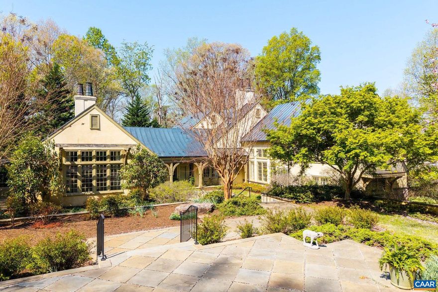 Tucked away on a serene, secluded 9-acre parcel, this breathtaking French Country home offers the perfect blend of refined living and pastoral charm?just 3 miles from town. Step inside to soaring vaulted ceilings adorned with hand-hewn beams, anchoring the spacious living and dining rooms?each centered around its own cozy fireplace. The gourmet kitchen is a chef?s dream, featuring a large central island, custom cabinetry, and a dedicated wine cellar for effortless entertaining. With 6 bedrooms and 6.5 baths spread across four thoughtfully designed levels, each private suite offers its own inviting sitting area, creating intimate retreats throughout the home. Outside, the meticulously crafted stone terraces and pergola set the stage for unforgettable summer evenings. A detached guest suite or office?with a full bath?adds flexibility for work or extended stays. Expertly constructed with the best materials including a copper roof and an energy-efficient Geothermal HVAC system, this home embodies quality, comfort, and elegance at every turn. An exceptional offering in one of Western Albemarle County?s most prestigious and sought-after locations.,Painted Cabinets,Solid Surface Counter,Wood Cabinets,Fireplace in Bedroom,Fireplace in Dining Room,Fireplace in Great Room,Fireplace in Living Room,Fireplace in Sun Room