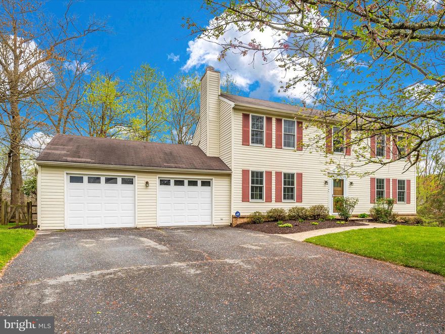 Step into the charm of this well-kept colonial gem nestled in popular Hunters Woods, where it sits quietly at the end of a peaceful cul-de-sac, with the tranquility of woods as its backdrop. This home not only features an oversized two-car garage with extra storage but also welcomes you with a variety of distinct living areas on the main level. Imagine unwinding in the separate living room, sharing meals in the formal dining room, or cozying up by the wood-burning fireplace in the family room — all beautifully laid out with hardwood floors.

The kitchen has been beautifully updated to please any culinary enthusiast, showcasing gleaming granite countertops, stainless steel appliances that include a brand-new fridge and gas stove with a griddle, plus a new microwave for added convenience. Ceramic tile flooring adds elegance to functionality, while a spacious deck off the kitchen invites outdoor leisure and entertainment.

Upstairs you will find four spacious bedrooms and two full baths, offering plenty of room for everyone. The basement is a bonus, finished with a level walkout, a large recreation area for more living space, and abundant storage to keep things organized.

The house is freshly painted and fitted with new carpet, ensuring it's ready for you to move in and make it your own. Recent upgrades include new windows in February 2023, and a new storm door and front door in November 2022, enhancing both aesthetic and function.

Located with convenience in mind, this home is just moments away from shopping, dining, and major commuter routes like Shady Grove Rd and the ICC, offering both the serenity of nature and the convenience of city living. Don't miss out on this perfect blend of comfort, style, and practicality.