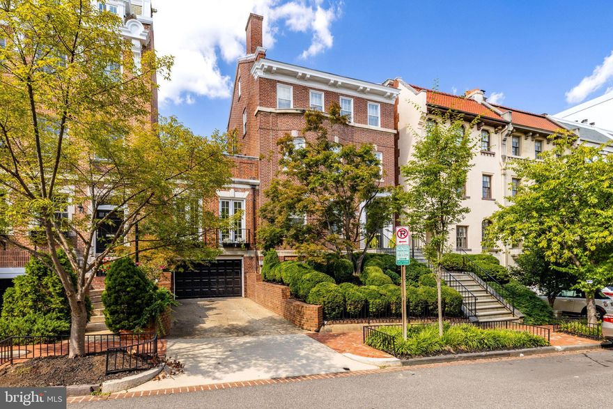 Significant PRICE ADJUSTMENT on this very special house on a beautiful block in Kalorama Heights. Elegant, grand yet so livable for today!  Entertain either glamorously informally or quite formally. Hide the dogs, or kids or caterers in the large, comfortable rear wing or open it all up and let it all flow! This south-facing and light-filled 1911,  beautifully remodeled, semi-detached townhouse has a wonderful floor plan. Gorgeous, large traditional rooms with stunning architectural details mingle gracefully with sought after more contemporary, informal spaces.  Large entrance hall; sun-kissed front reception/music room; huge living room; banquet sized dining room  and a beautiful,  white,  large open kitchen with island breakfast bar,  completely open to a family room and informal dining area. This combination of spaces is rarely found in Kalorama.  All primary rooms on the main level open on grade to the private, large rear terraces and garden by way of walls of windows and doors. 10 ft ceilings. 6 fireplaces. Operating pocket doors! Coffered ceilings and wainscoting.  ELEVATOR to all floors. This property lives like a DETACHED house and in fact is only partially attached on one side.   Wonderful 2nd floor primary suite with gorgeous bath has its own inviting private roof deck.  Handsome paneled library/office also on 2nd floor. Three additional large bedrooms and two baths on 3rd floor.  There is even a storage attic. Great lower level with separate side entrance includes large bright family room or exercise room (or BEDROOM); full bath; closets and storage;  Temp-controlled  WINE CELLAR; laundry and ATTACHED GARAGE access. 
WALK SCORE 97.  1/2 mile to Dupont Circle  METRO.  Mitchell Park just minutes away.