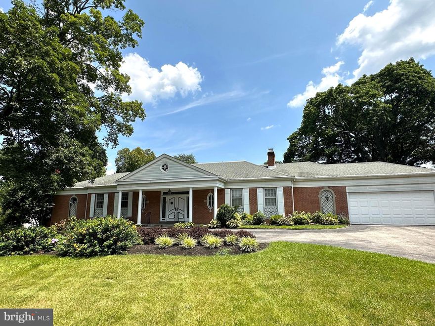 You will love this custom built and extremely spacious home (sq ft = 4964 above grade and +/- 750 finished lower level) nestled amongst mature trees and elegant older homes. The approach to this home is from a wide circular drive. The double doors welcome you into an utterly charming 2 story foyer with white marble flooring, black accents, and classic wall trim molding. A beautiful curving staircase leads upstairs to two bedrooms, 2 full baths, and storage areas. The three arched doors in the foyer access the library, a powder room, and a walk-in closet. The library has custom wood paneling throughout and a wonderful fireplace for a cozy place to relax.  As you walk through the foyer you will reach the gracious, bright sunken living room with a fireplace as the focal point. The enormous, newly replaced windows give you fabulous views to the outside grounds and generous sized pool. Step up to the large dining room which carries through the white marble flooring from the foyer. The dining room also has large replacement windows offering a lovely view of the pool. The kitchen features two islands within a well laid out floor plan. A newer chef’s 5 burner stove was converted to gas from previous electric one. The full-sized refrigerator and full-sized separate freezer will hold plenty of food for family and friends. A microwave and second oven are situated in the wall cabinet on the left. The sunny breakfast area looks out over the brick patio, back yard, and pool. Down the hallway, and past the foyer, are access to steps to finished lower level . The hallway continues to three bedrooms. The large master bedroom, with incredible built-in closets, bath and addition through the sliding glass doors give you so much space to spread out. The master bath has white marble flooring and walls as well as double sinks. The unique tub is a masterpiece of charm. There is a walk-in shower. The addition off the master bedroom can be used as a gym or otherwise repurposed. Two other large bedrooms have a Jack and Jill bath to share. Both bedrooms have ample closet space and are bright rooms. By the way, notice the gleaming recently refinished hardwood floors throughout almost all areas of the home. The lower level has a small office space, a powder room, full bar area and a big entertainment room with a raised hearth and fireplace. Off the main room is access to the heater/ AC.  This home has a High Efficient gas 6-zone heater/AC installed in  2015.  Sliding glass doors provide access to the beautiful walk-out brick patio with another fireplace for outside entertainment.  A few steps up is the oversized 38,000-gallon pool, a pure joy for summer living. This property is close to Lankenau Hospital, Center City and 1.2 miles to Wynnewood train station. The home has a pre-listing home inspection from Carl D. Hertzog,III.  This inspection report  is available to pre-qualified, interested buyers. This outstanding home is not to be missed for those home buyers wanting plenty of space, large bright rooms, ample storage rooms and closets, and an amazing swimming pool. Property was taken off market 12/20/22, put back on 4/7/23. This was due to a few corrections made and  owners being out of town for a considerable time.