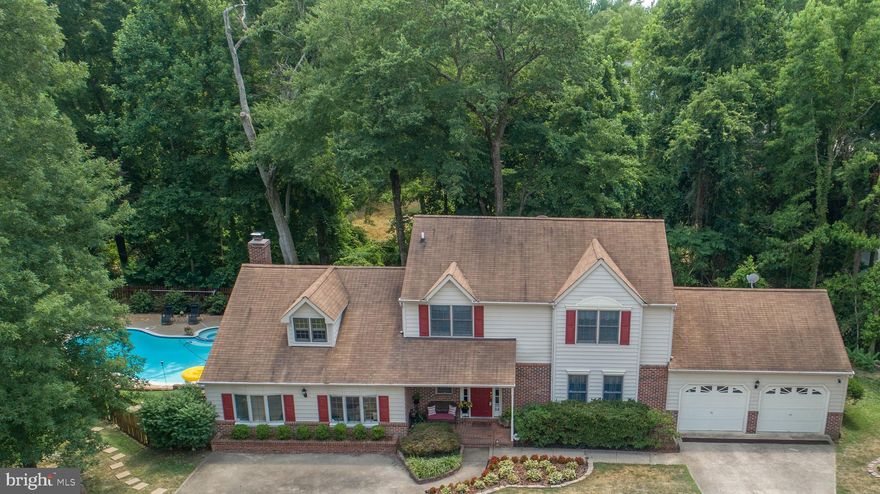 MULTIPLE OFFERS RECEIVED. DEADLINE FOR OFFERS OF 7/20/2020 @ 4PM. Looking for a home with ample indoor and outdoor space to spend your time, with no HOA? You've found it! Beautiful colonial in a cul-de-sac location features 5 bedrooms, and 3 full baths.  This home was the original model home for Breezewood, has been lovingly maintained and upgraded.  2 master suites; one on first floor and one on the second floor accommodate everyone.  Formal living room, dining room, eat-in kitchen, den, and additional room currently used as an office (could be used as an additional bedroom) on the main level offers space for those working or schooling from home.  Living room with gas fireplace and french doors that open to the wooden deck on the rear of the home.  A central staircase leads to 4 bedrooms and 2 full baths on the upper level.   Large master suite on 2nd floor with walk-in shower and dual vanities.  Central bedroom on 2nd floor currently used as additional office with office furniture (desk/chair, bookcase, table) that conveys. Flat screen wall-mounted TV's in 1st floor office, 1st floor master, and 2nd floor rear bedroom convey.  Property backs to mature hardwoods increasing the privacy and seclusion of the cul-de-sac location, as you relax on your deck overlooking your in-ground outdoor pool and Jacuzzi. Can you hear your favorite tunes coming through on the outdoor speakers now?  Pool has been well maintained and comes with everything you need; new solid Loop-Loc cover, solar cover, gas heater, 2 Polaris vacuums, and new pump all add additional value.  Even comes with square wrought iron table w/ umbrella and chairs, 2 gravity recliners, pool chemicals, floats and towels so you can dive right in!  Attached 2 car garage and separate driveway for ample parking. Have pets? This property is equipped with Invisible Fencing and comes with controller and 1 large + 1 small collar.  Small victory garden has been started on the side of the home, with space for expansion.