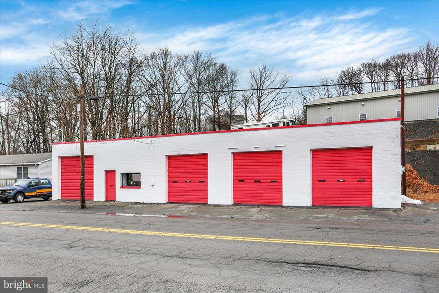 Located along Laurel Boulevard in Pottsville, this well‑maintained commercial property at 1260 Laurel Blvd offers a highly functional setup for automotive or light industrial use. The building is currently vacant, presenting a blank slate for an owner‑operator or investor seeking immediate occupancy or redevelopment flexibility.
The property features a clean, block‑constructed exterior accented by eye‑catching red garage doors that provide strong street visibility and convenient road access. Inside, the open garage layout includes multiple service bays, high ceilings, durable concrete floors, and ample overhead lighting, creating an efficient workspace suitable for repairs, service, fabrication, or customization.
The sale includes two rotary auto lifts, adding immediate value and reducing startup costs for automotive users. With solid curb appeal, a practical interior configuration, and a location convenient to local traffic routes, this property is well suited for continued automotive use or a variety of commercial and light industrial applications.