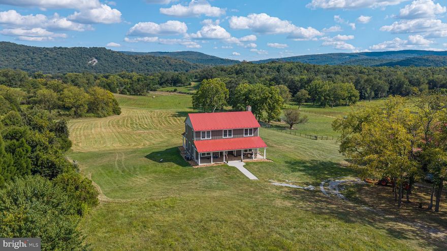 Tilthammer Mill Farm - a high standard was set when this house was constructed in 2020 - 10' ceilings, 8' doors, custom everything -  beautiful floors, 1600 square feet on each of three levels - this light filled home is crafted with care and precision with the best building materials.  This thoughtfully designed house is well insulated and energy efficient, hardiplank exterior, top of the line windows, doors, and hardware show the care and thought put into the construction.  An open floor plan downstairs makes for great family space, the kitchen and large family room with stone fireplace offer cozy entertaining - step out onto the porch from the family room for more space and fantastic views.  Gourmet kitchen has top of the line appliances, beautiful granite counter tops and loads of space for the creative cook.   A a main level master suite, office or library space, super mudroom and laundry finish off the first floor.  Two large thoughtfully designed bedrooms with large separate baths can be found on the second floor with roomy common spaces for home office or art studio - all filled with natural light.  The lower level of this home features a second kitchen space, large common area, fourth bedroom and full bath.  Complete with stone walk-out entrance to side yard.  The views of the Blue Ridge Mountains are spectacular from every window of this house  as well as front and back covered porches - situated on 79 lush acres - Tilthammer Mill Farm sports rolling pasture land and some lovely wooded acres providing habitat for turkeys, deer, fox and birds of every kind - truly a wildlife refuge.  Great grazing for horses and cows, sheep and goats.  The farm has a 30 acre hay field yielding good grass hay.  A fully renovated bank barn adds special character to this special property  -- the 36" thick stone foundation has been fully rebuilt, new oak siding and flooring throughout - the original pegged beams have been maintained throughout the years - a prefect party barn upstairs and the lower level just waiting to be fitted out for horses.  A small portion of the property near the barn is fenced  to get you started.  This property is private and charming, with additional building lots for a family compound.  Shenandoah river access close by.   Convenient to route 50 for the commuter.  10 minutes to Upperville, 20 to Middleburg, route 66 20 minutes as well.  Winchester 20 minutes and Berryville 15.  Easy drive to Washington DC in an hour, Dulles international airport 50 minutes.  Great area schools and low Clarke county taxes.  The village of Millwood just up the road a mile or so.  This property a find!!  Interior photos coming!!