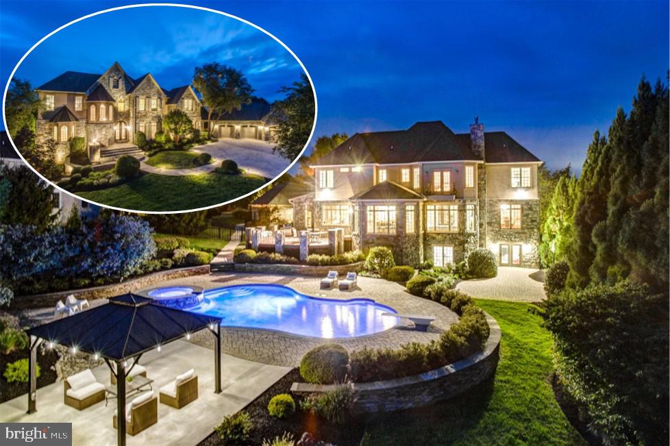 Magnificent, stately stone and stucco masterpiece in sought-after Fox Meadow in West Friendship. A grand curved stone patio and wrought-iron doorway welcome you into close to 9,000 square feet of luxurious finished living space. The foyer stuns with natural stone tile flooring, 10 foot ceilings, curved staircase and arched entries into every room. Main level living continues with architectural details at every turn - triple crown moldings, chair rail, shadow boxing, 8 foot doorways, oversized windows and custom treatments throughout. Entertain a dinner party in the massive dining room with hardwood flooring and ornate moldings or lounge in the library with views overlooking the landscape. Step down into the sunken family room with hardwood flooring, gas fireplace with floor-to-ceiling stone hearth and coffered ceiling. The gourmet kitchen is sure to impress the most discerning chef with Heritage custom cabinetry, Viking stove and ovens, granite countertops, wine fridge, center island with custom butcher-block top, and tiered breakfast bar. This kitchen is full of surprises - hidden spice racks, warming drawer, pot filler, stylish cabinet fronts conceal the full sized Sub-Zero refrigerator, full-sized Sub-Zero freezer and dishwasher, reverse-osmosis filtration system, and don't miss the built-in vacuum system! Enjoy breakfast in the octagonal breakfast room with panoramic views of the back yard or cozy up with coffee next to the gas fireplace with stone surround. Butlers pantry with wine fridge, additional office with built in desk and workstation and plenty of cabinetry. Two other wings off the main level offer a private nook for reading with half bath, or a mudroom area with laundry room, laundry chute, second powder room, coat closet with custom shelving and access to back staircase. The soaring ceilings continue to the private level living. The master suite offers a privacy entrance through hidden pocket doors. The huge main room boasts hardwood flooring, tray ceiling with up-lighting, access to private balcony and sitting area with gas fireplace. Two huge walk-in closets and private bath with natural stone flooring, dual shower fixtures, dual vanities, circular, jetted, heated tub with waterfall and separate water closet finish this suite. Three other generous bedrooms with walk-in closets and two additional full baths complete the upper level. The lower level features a recreation room that spans the length of the house with stone wall and color-changing fire feature and full bath. Gym complete with equipment, storage room with tons of shelving, utility room with two water heaters, water filtration system, central vacuum and humidifier. The in-law suite offers a 5th bedroom with walk-in closet, kitchenette with quartz counter and wet bar, and private full bath with oversized shower, built-in bench seating dual shower heads and separate water closet. Two walk-outs offer private entrance/exit for in-law suite and main entry from yard. Outside, the grounds are an entertainers dream. A stone and composite deck sets the stage, overlooking a stone-paver patio surrounding a heated in-ground pool and jetted hot tub with waterfall. A pool-side gazebo is the perfect spot to lounge, offering a fire pit and access to internet and electricity. Three-car garage with storage space, cabinets and two side entrances offer easy access. The meticulousness of the professional landscape and hardscape of the exterior, rivals the details found on the interior. Hidden under the impressive scenery is a drainage system for rain water. With so many details, you must visit this home to truly appreciate all it has to offer! One year home warranty included!