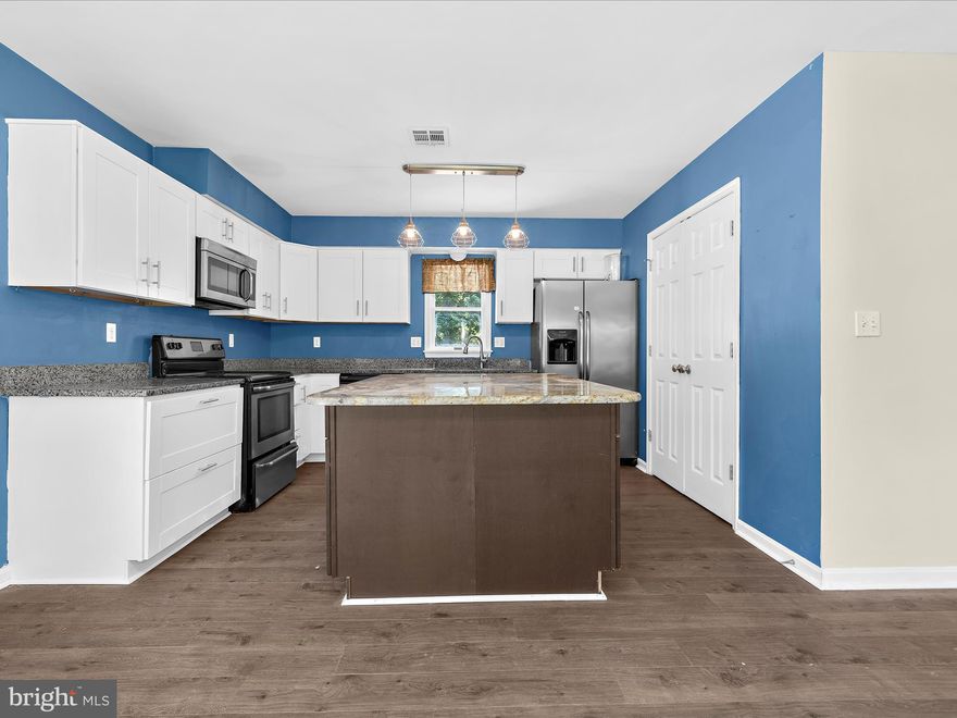 Price Improved ! Welcome to 317 Melvin Avenue in the peaceful community of Grasonville, MD. This charming 4-bedroom, 2-bath home offers over 2,100 sq. ft. of living space on nearly a half-acre lot—a wonderful blend of comfort, style, and value!

Step inside to an open, inviting layout that flows effortlessly from room to room. The updated kitchen features stainless steel appliances, granite countertops, and a spacious center island that opens to the expansive family room. A sliding barn door adds character and leads to a versatile bonus room or home office.

The primary suite includes a large walk-in closet and updated ensuite bath, while three additional bedrooms and another renovated full bath provide ample space for family and guests. A large mudroom adds everyday convenience.

Outside, enjoy your 12' x 24' Kayak pool with an 8' deck—perfect for summer fun and entertaining. The fully fenced backyard offers plenty of room to play, relax, or garden. With no HOA, covenants, or restrictions, you have the freedom to make this property truly your own.

Discover the laid-back Eastern Shore lifestyle and make 317 Melvin Avenue your next home!