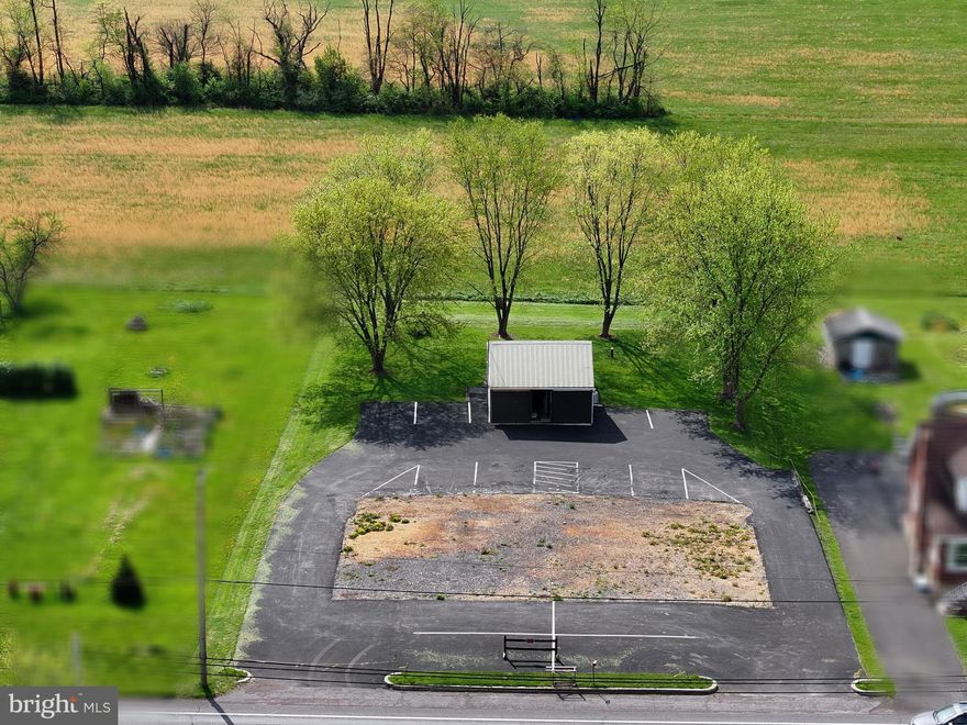 This land with road front access is ready for you to build your dream home. Black topped lot with water and sewer available and a nice shed to store your things while you are building your dreams. Do not miss out on this sweet property!!