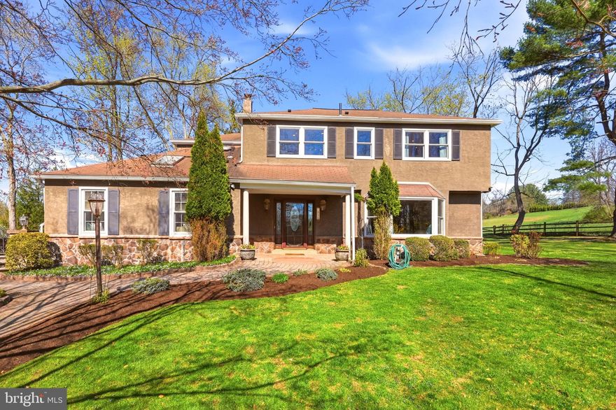 Mature landscaping, professional hardscaping, a heated in-ground pool, and a private 1.4-acre lot set the stage for 916 General Howe Drive in the award-winning Unionville–Chadds Ford School District.
Inside, you’ll find hardwood flooring throughout most of the home. The spacious Living Room features a large bay window and crown molding, while the Dining Room offers crown molding and chair rail detail. The updated Kitchen includes stainless steel appliances, granite countertops, tile backsplash, a desk area, walk-in pantry, and a convenient laundry closet. From the Kitchen, step into the 3-season room—perfect for taking in the surrounding nature—with access to the deck and pool area. The first floor also features a Den with built-in bookcases, skylight and an attached full bath. With its own private entrance, this space is ideal for an in-law suite or private retreat. Rounding out the main level is the Family Room with hardwood flooring and a brick gas fireplace. On the Second Level, the spacious Primary Suite features a walk-in closet and a private bath complete with tile flooring, a whirlpool tub, separate shower and commode area, and a double vanity with granite countertops. There are three additional bedrooms, all with ceiling fans, along with a tiled hall bath featuring a shower/tub combination and skylight. The finished lower level offers cedar-lined closets and abundant storage. All of this is complemented by a one-year home warranty that includes pool coverage,  Surround Sound Speakers both inside and outside, back-up generator, a new hot water heater (2020), new windows throughout most of the home (2023), and updated HVAC in select areas. Don’t miss your opportunity to make this home yours!
