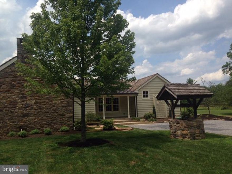 Here is an exquisite cottage on a beautiful farm estate just minutes outside New Hope. Enlarged and renovated from top to bottom, with design by award-winning architect Ralph Fey. Set apart from the main house, with views of barns and pond, this stone and frame cottage is like no other. Random-width cypress floors (with radiant heat throughout). Old stone walls. High ceilings. Gas fireplace with Mercer tile surround. Walls of windows. French doors to a bluestone patio. The kitchen is large and opens to the living room. Granite counters and island, top-drawer appliances, thoughtful and distinctive lighting, high-end cabinetry, glass tile backsplash, and views of gardens, woods, the restored barn. The kitchen has plenty of room for a large dining table and chairs. The bedroom, separated from the main living area by the foyer and a clever sliding barn door, features an old stone fireplace (non-functioning), windows on two sides, a large walk-in closet/dressing room and a stunning all-new bath with beautiful tile floors, soaking tub, double vanity and tile shower. The laundry is located off the bedroom. This very special rental offers privacy, views and luxury in an exceptional rural setting. Please note size is about 16OO sq. ft.