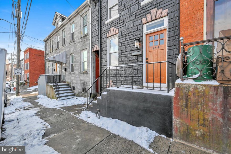 This fully renovated historic row home offers the perfect blend of classic charm and modern amenities. Located in the heart of historic Lancaster, this dream home features stunning skyline views of downtown Lancaster City from your own front porch, just a 5-minute walk from Penn Square. The vibrantly painted stone exterior and natural stained wood front door create eye-catching curb appeal.  Once inside, you'll find beautiful LVP flooring throughout the main floor as you navigate through the spacious family room and dining area. The gorgeous kitchen boasts a captivating stained wood vaulted ceiling as well as crisp white cabinetry with butcher block countertops and brand-new stainless-steel appliances.   The second floor is host to a primary bedroom with an ensuite bath featuring a tiled shower.   A second full bath, and a convenient laundry area are also located on the second floor.  A cozy second bedroom, located on the attic floor offers a spectacular window view of downtown Lancaster City in all its glory!    Modern upgrades also include all new replacement windows throughout.  The property also features a spacious level backyard to enjoy the outdoors as well as two off-street parking spaces. Don't miss your chance to own this breathtaking home!  Schedule your private tour today!