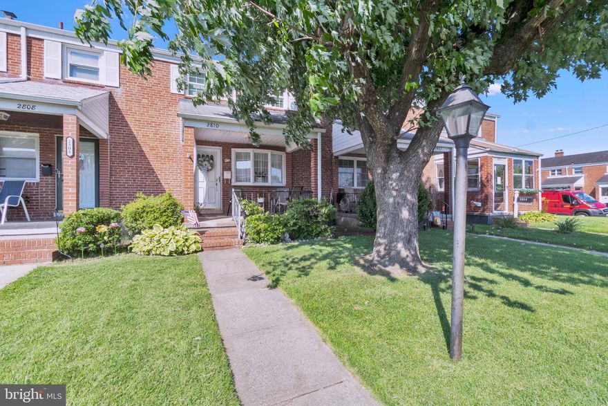 Porch front townhome in Dundalk's Stanbrook community! This brick townhome has been lovingly cared for by its original owner. Enter the living room  with hardwood floors under the carpets & custom built-in shelving in this space & formal dining room. The kitchen has gas cooking & refrigerator with an ice maker. Upstairs are 3 bedrooms with 1 full bath. The basement is also finished & perfect to entertain guests or enjoy a game. The fenced rear yard has a patio with a covered awning & parking for two vehicles. Recent updates include the upper windows & the water heater.