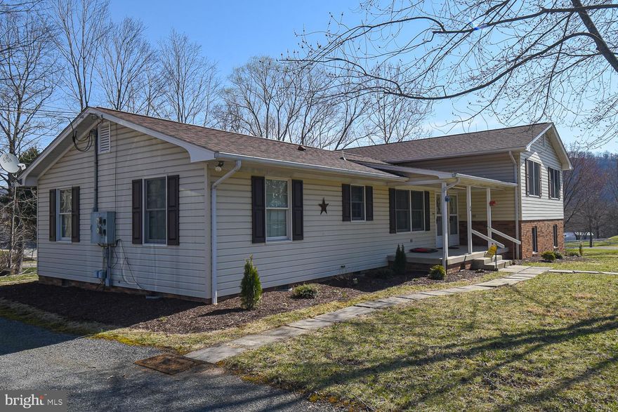 They don't make duplexes better than this one!  Situated on just under a half-acre of Wild and Wonderful WV, this is the PERFECT investment opportunity.  With a bi-level design, this is one of the more unique multi-units out there.  All utilities are metered separately.  Both sides feature 3 beds and 1 1/2 baths.  The vacant side has recently been refloored and repainted throughout.  A large level lot leaves ample room for further expansion, too!  There's a shed that's split in half to be utilized by both units.  Large gravel parking area on the side.