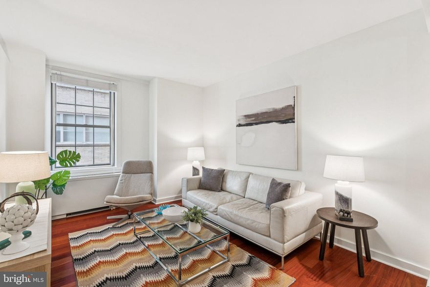 Graciously appointed one-bedroom home at Parc Rittenhouse offering a cozy retreat with high ceilings and practical, stylish layout and included in-building PARKING! The spacious living area features Brazilian Cherry hardwood floors, while the state-of-the-art galley-style kitchen boasts granite countertops, stainless steel appliances, tiled flooring, and under-cabinet lighting. The large bedroom includes plush carpeting, two excellent walk-in closets—including one with custom built-in organization—providing ample storage. A well-appointed bathroom features a Carrera marble vanity, a tub/shower combination, and Kohler ‘Purist’ fixtures. For ultimate convenience, the unit includes an in-unit dual LG washer/dryer, and a one-car PARKING license within the building - take the elevator from garage right to your floor.  Residents enjoy top-tier amenities, including 24-hour door staff, a state-of-the-art fitness center, a resident lounge, a media room, a private theater, a conference room, additional laundry in the building, and a rooftop pool club with full-size pool, kids’ pool, hot tub, and a stunning sundeck with skyline views. This apartment is an ideal pied-a-terre, starter home or investment property, solid long time rental history. Perfectly situated directly on Rittenhouse Square, walk out your front door and right into the park. This home offers seamless access to world-class dining, shopping, and entertainment, with renown favorites such as Parc Restaurant (accessible downstairs in the lobby!), Via Locusta, Metropolitan Bakery, La Colombe, and much, much more! Don’t miss this incredible opportunity—schedule your showing today!