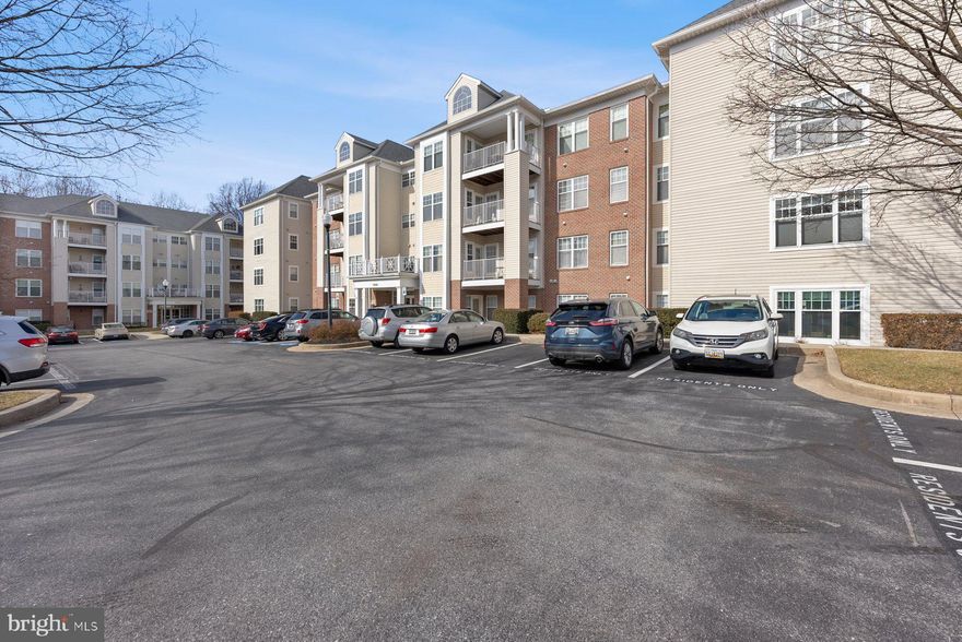 Come see this lovely condo in the outskirts of Ownings Mills! On the third floor of this well-maintained building (with central elevator), the spacious unit has everything! This is one of the largest units, and handicap accessible. The gourmet kitchen has loads of cabinet and counter space including the large island for casual meals. The family room is huge and boasts a gas fireplace with a lovely mantle. You can enjoy large furniture in this space! In between there is a spacious laundry room, a hall bathroom and the second bedroom, with loads of closet space throughout. The primary bedroom is at the end of the sunlight drenched room with a huge bathroom. A jet tub and separate shower with a double sink and you have got it made! Other details - all rooms have generously sized window sills, hardwood flooring, separate den, crown moulding, fresh paint throughout, all new w/w carpet. .. all this and it’s a great place to entertain! 
Come see this lovely, ***READY TO MOVE IN*** home sweet home!