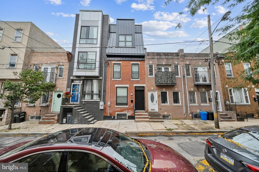 Welcome to 1741 Annin Street, a one-of-a-kind home in the desirable Point Breeze section of South Philadelphia. Step inside to be greeted by an expansive, open-concept first floor, featuring a spacious living room and dining area that seamlessly flows into a state-of-the-art chef’s kitchen. The kitchen is a true showstopper, boasting quartz countertops, sleek white cabinetry, stainless steel appliances, and more. From here, you’ll have access to your private backyard oasis. Upstairs on the second floor, you'll find two generously sized bedrooms, a laundry area, and a beautifully appointed hallway bathroom. The third level is dedicated to the luxurious main suite, complete with an oversized bedroom, ample closet space, a wet bar, and a stunning main bathroom that feels straight out of a magazine. Featuring dual floating vanities, soaking tub, and an impressive walk-in shower, this bathroom is sure to impress. A few steps higher and you’ll reach your private rooftop deck, equipped with water and electrical lines—perfect for enjoying breathtaking views of the Philadelphia skyline. The lower level offers a versatile open area that can serve as a den, study, or workout space. This level also houses all the home’s mechanical systems, storage area, and a full bathroom for added convenience. Located near public transportation, highways, restaurants, grocery stores, and more, this home has been meticulously renovated from top to bottom. It’s a must-see! Don’t miss the opportunity to make it yours.
