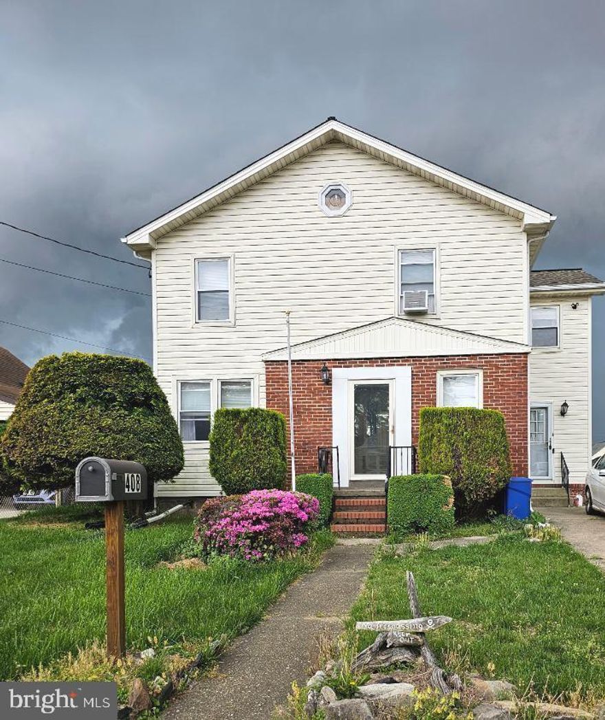 This Large home is located in a water oriented community close to parks, community marina with boat ramp and school. 
This home offers 5 spacious bedrooms, (primary bedroom with walk in closets and sitting room/office) 2 1/2 baths, partially finished basement, large updated kitchen with an abundance of cabinets with cook-top and wall oven, great room /dining room leading to level fenced rear yard with greenhouse and shed and so much more.  Although this home is being sold "As Is" due to it being an estate sale, it has been very well maintained and is in good condition only needing some cosmetic items.