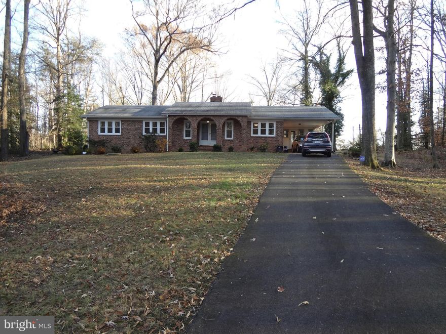 Great location, 5 minute walk to VRE. Close to school, shopping & I95. Spacious rambler on over 5 acres. Hardwood floors, separate dining room, 2 fireplaces, sunroom, carport, shed, detached garage and huge unfinished basement. Pets accepted on case by case. Culligan water system. Paved driveway, new double pane vinyl windows.