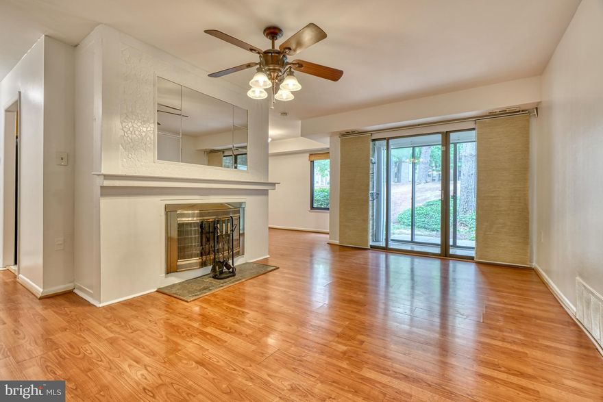 Price Reduction, Huge Value! Welcome to 10551 Twin Rivers Rd Unit B-2, a 2 bedroom condo located in a private and quiet community, just minutes away from the heart of Columbia! This unit has been extremely well maintained and cared for, and features gleaming hardwoods and natural light throughout! The galley kitchen is complete with granite countertops and updated appliances. Enjoy dining in the separate dining room, cozying up in the living room by the wood burning fireplace, or lounging in the bonus sunroom with access to the outdoor tree lined common space. Spacious primary bedroom includes walk-in closet and en-suite bathroom. Laundry on site as well as separate storage unit available for tenant use. Unit comes with 1 assigned spot and ample guest parking. Close proximity to the heart of Columbia, near all of your daily conveniences and major commuting routes. Schedule your showing today!