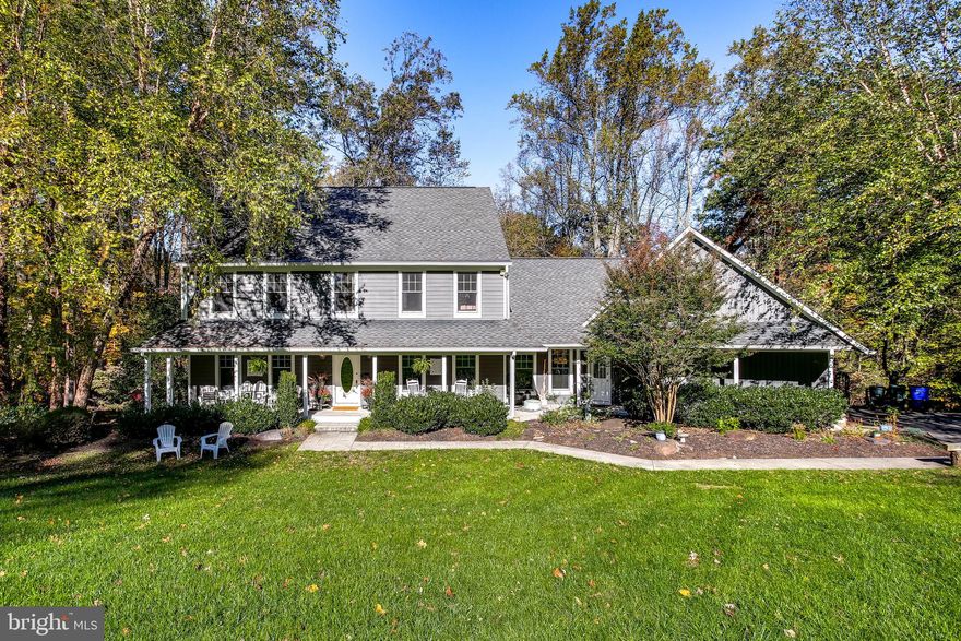 Fantastic opportunity to own a spacious home with more than three acres of stunning outdoor living space, in the Marriotts Ridge High School district!  Located at the end of the cul de sac, this home offers 6 bedrooms and 4 1/2 bathrooms (in-law/au-pair suite includes one of the bedrooms and full baths). The main level is the perfect spot for entertaining, with lovely crown molding and hardwood flooring throughout, from the large eat-in kitchen with silestone countertops, stainless appliances, gas cooking, island, prep sink, table space, breakfast bar, pantry, and updated slider to the deck; to the family room which features a wood-burning, stack-stone fireplace.  The formal living room, dining room,  private office, powder room and laundry room are also located on the main level. The upper level features a spacious primary suite with an immense walk-in closet, en-suite full bath with dual vanities, a large tub, plus a separate shower; three additional bedrooms with hardwood flooring, and a  lovely upgraded second full bath. In the lower level, you'll find plenty of space for fun!  A carpeted recreation room, with walk-out exit through the slider to the rear yard; the sixth bedroom, a third full bathroom, a workshop area, plus additional closets for storage. The attached in-law/au-pair suite is the perfect accompaniment to this home; offering a large fifth bedroom with a walk-in closet, plus a fourth full bath. The exterior features an enormous covered front porch, a large rear deck, an attached side-entry two-car garage, scenic wooded views, firepit area, and a private nature trail.

Updates include gutters, HVAC systems, water heater, well pump, exterior painting, upper level bathroom, propane tank, and more!