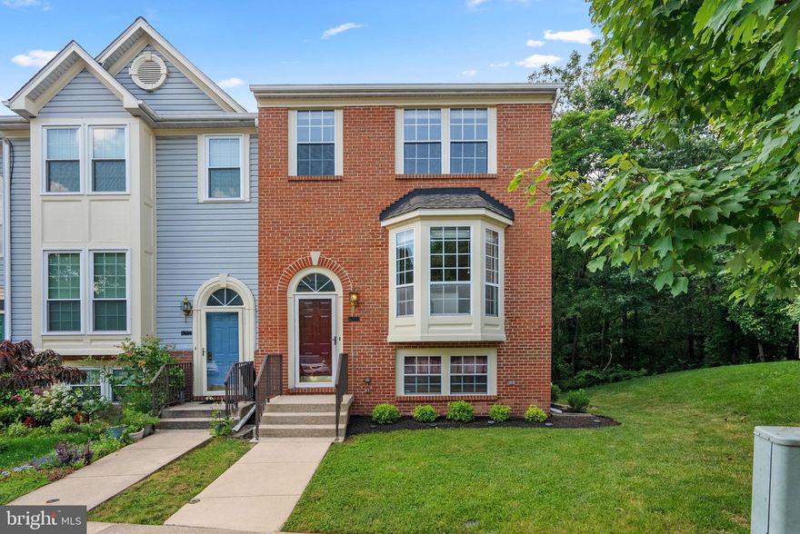 Turn it up this Summer in your very own 4 Bed 3.5 Bath Brick End of Row situated on a manicured premium lot backing to lush greenery featuring hardwood + fresh neutral paint everywhere! Party starts upstairs in the sunlit Kitchen/Dining/Living trio showcasing solid wood cabinetry, beautiful granite countertops, electric stove/oven, French door refrigerator, built-in microwave, gorgeous mobile island, trendy backsplash, pass through window, bay alcove, coat closet, Powder Room, and double sliding access to huge, private deck for fabulous entertaining! Celebrate some more in the Lower Level Family Room with Bedroom #4, Full Bath, decorative fireplace, stone patio, extra refrigerator, bonus storage, and new side by side Whirlpool Laundry! Rest and recharge on the second  in your very own Primary Suite with vaulted ceiling, walk-in closet, and 5-piece bath! Down the hall are Bedrooms #2 + #3 with shared tub shower! Hooray for plenty of unassigned lot parking! Look forward to good times at the community Playground/Tennis Court/Clubhouse/Trails! Stay cool at the fenced in Pool! Get excited for shopping at nearby Costco, Trader Joe's, ALDI, Walmart, Target, Giant, Starbucks, Home Depot, Lowe's, Wegman's, Whole Foods, Mall in Columbia, and Arundel Mills! Enjoy being close to I-95, Route 100, Route 175, I-295, Route 32, Route 29, Fort Meade, BWI Airport, Rockburn Branch Park, Blandair Regional Park, Lake Elkhorn, Columbia Lakefront, and Merriweather Post Pavilion! Howard County Public Schools! See you soon!!!