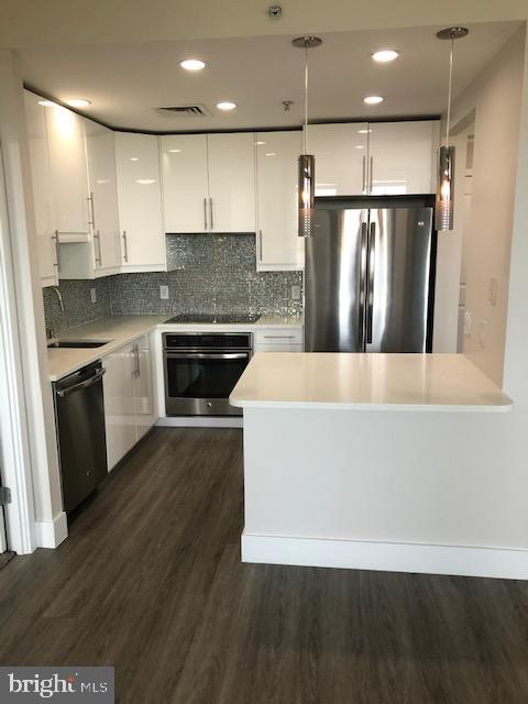 Absolutely MUST SEE!! Beautifully renovated 2 bed, 2 bath Luxury Condo in the highly sought after Paramount Condominium! COMES WITH TWO RESERVED GARAGE PARKING SPACES!! Completely Updated, Open Floorplan boasts soaring 9 foot ceilings, Oversized Windows, Huge Dual-Entry Balcony, Designer Light Fixtures, Custom Built-Ins in BOTH walk-in closets, and MUCH MORE!! OVER $100,000 IN RENOVATIONS!! Gourmet Kitchen w/ SS Steel Appliances, Modern Custom Cabinetry, Quartz Countertops, Large Kitchen Island accented by Pendant Lighting. Luxury Spa-Inspired Bathrooms w/Frameless Showers, Closet Organizing Systems, Luxury Vinyl Flooring & Freshly Painted. Spacious Living/Dining area accented by Large Windows and access to a Private, Covered Balcony with Gorgeous Views of RTC & the Mountains in the Distance. Modern Gourmet Kitchen with Spacious 42” Cabinetry, Quartz Countertops, Breakfast Bar with spaces for seating, Under-Mount SS Sink, Stainless Steel Appliances, Closet for Front Loading Washer & Dryer w/ Storage Shelves, Pendant & Recessed LED Lighting & Under Cabinetry Lighting. Large Master Bedroom w/ Walk-In Closet Organizer System. Luxury Master Bath w/ Oversized Frameless Glass Shower, Spacious Vanity Cabinets, Large Separate Storage Closet w/ Mirror. Second Bedroom also has Walk-In Closet w/Organizer System, access to the Balcony, Luxury Hall Full Bath w/ Large Frameless Glass Shower, Vanity Cabinets, Separate Wall Storage Cabinet.
Soak in the Unencumbered Views of Sunsets over the Blue Ridge Mountains. Two-Side-by-Side Garage Spaces and an adjacent Storage Unit In close Proximity to Garage Exit.
INCLUDED IN RENT: Gas, Water, Ample Exterior Reserved Parking For Guests & Contractors, New Entire Building Security System w/Secured Access, Front Desk Concierge Servicers & Underground Updated Secured Parking w/Multiple Elevators; Building Guest Suite On-Site, Club Room, Outdoor Pool, (2)-Recently Updated Gym & Exercise Rooms w/Brand New State Of The Art Equipment, Party Room, Billiards Room, Picnic Area & Common Grounds.
Enjoy the walkable lifestyle of living in the Heart of Reston Town Center: Walk to Reston Town Center & Central Pavilion, Walk to Reston Hospital Center, Harris Teeter, Pet Smart, Best Buy, Starbucks, Cava, Einstein Bagels, La Madeleine, CVS, Restaurants, Fine Dining, Town Center Events, Theater, Summer Concerts, Skating Rink & W&OD Trail. Public Transportation: Easy Access to Dulles Toll Road, Silver Line Metro, Bus Depot at RTC, RT 7, Fairfax County Parkway & 15-Minutes to Dulles Airport.