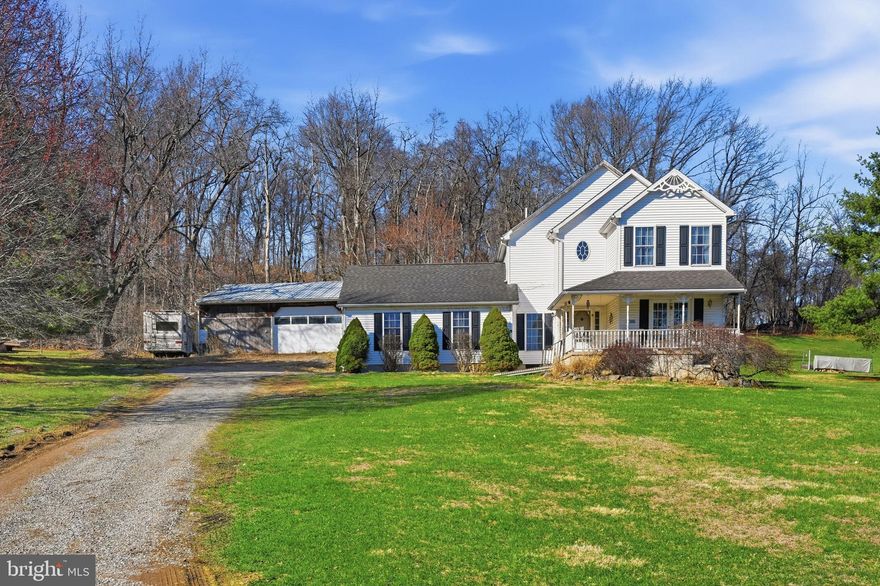 Commanding an elevated position at the top of the hill in the Saucon Valley School District, this two-story Victorian-style home sits on a 2.1-Acre lot offering an ideal blend of modern efficiency and versatile space. This is a premier find for a buyer seeking a classic silhouette paired with a functional interior and ample room for nature views, privacy, and serious hobbyist pursuits. The interior flow begins with an Open Foyer leading into a functional Center Hallway that anchors the Main Level. To one side sits the spacious Living Room, a bright haven where plants thrive. This room features a cozy Propane Fireplace with a Gorgeous Mantel and Double Doors that open directly to the Front Porch for a seamless connection to the hillside. The heart of the home is the expansive Family Room, where awesome Skylights flood the space with natural light and a Pellet Stove grounds the room as an efficient supplemental heat source. Adjacent to this area, the Kitchen is neutral and functional, equipped with a Center Island and a peaceful view from the sink overlooking the back of the property. The Upper Level opens to a center landing reading nook and opens to all bedrooms. The Peaceful Primary Bedroom Suite serves as a true retreat, featuring an Ensuite Full Bathroom with a soaking tub, a separate shower, a double bowl vanity, and a generous Walk-in Closet. Two additional well-appointed Bedrooms and a Full Hall Bathroom complete the second floor, maintaining a bright and intuitive footprint throughout. For those requiring substantial workspace, the utility of this property is a standout feature. The Massive Lower Level provides an entire level of blank canvas with built-in shelving, ready to be finished into a Rec Room or kept as a high-utility zone. This level also features a convenient staired walkout leading directly into the attached 2 Car Garage. Beyond the main house, the grounds include an Oversized Detached Barn with a 1 Car Garage and ample additional square footage for a workshop, crafting studio, or equipment storage. Occupying a prominent hilltop position, the home offers plenty of room to breathe on its 2.1-Acre lot. Despite the quiet setting, the location is exceptionally convenient, offering direct access to Route 78 for an easy commute and proximity to the premier shopping, dining, and community events of Saucon Valley. This is the ultimate opportunity to bring your vision to a property with limitless potential.