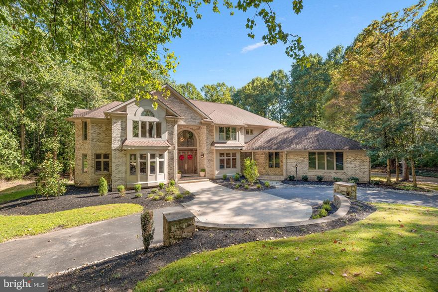 Exquisite custom entertainer’s dream sited on a professionally landscaped 1.64 acre homesite adjacent to a fairway at Hobbit’s Glen Golf Course is this picturesque estate reminiscent of a French Country manor spanning over 8,888 sqft with an exterior blend of brick, siding, and multiple rooflines that combine to give great curb appeal. First impressions are lasting from the circular drive approach escorting you to this luxury manor and continuing as you enter the expanded 2-story marble foyer with a curved staircase set in rotund architecture with multi-levels of windows, and as you tour this home also showcasing beautiful hardwoods, arched doorways, statuesque columns, and sophisticated moldings. Amazing exteriors include a landscaped yard with Hobbits Glen fairway views, a sports court, a path from your backyard to the 13th hole of the adjoining golf course, designed night lighting, a tiered low maintenance deck, an expanded flagstone patio, and a mature tree surround adding to the privacy. Step inside to find a formal living room centered by a warming fireplace, and a formal dining room with an accented hardwood floor and a flow to the butler’s pantry, followed by a study with built-ins and a conservatory. Perfecting your culinary skills, the chef’s kitchen [2020 remodeled] boasts extended quartz counters and workspaces, custom white cabinetry, iridescent white subway tile backsplash, an infinity island with a cooktop and breakfast bar, top-of-the-line stainless steel appliances including a Kenmore elite double convection oven, a Viking refrigerator, a 6-burner gas range, and a rotund open breakfast room providing a relaxed dining experience with incredible views of a tree-lined yard and the golf course. Adding to the entertainment is the a family room with a fireplace and vaulted ceiling, a great room with a cathedral ceiling, and fireplace, and a cool tile floor embellishing the sunroom. Guests will enjoy exposures to a low maintenance tiered deck for outdoor living and dining spaces from atrium doors in the breakfast room and a great room adorned with a stacked stone fireplace. From the upper hallway you step up to double doors opening to a private owner’s suite highlighted by a cathedral ceiling, an ambient fireplace, a coffee bar, a sitting room, a private balcony, walk-in closets complete with custom organizers, and a spa inspired bath with separate vanities, a super shower with bench seating and dual shower heads, and a relaxing jetted tub. Accommodating your desire for enjoyment and relaxation is the lower level offering a rec room anchored by a granite wet bar with dishwasher and beverage fridge, a speaker system, a game room, an Au Pair or guest suite with a steam shower and a separate entrance, a play or game room, and an expansive flagstone patio adding to you entertainment venues. Within easy reach of the golf course, cultural centers, airports, commuter routes, elegant boutiques, and exceptional dining.