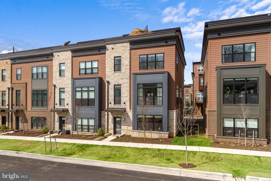 Welcome to 3214 Royal Fern Place, an exquisite end-of-row townhouse in Tower Oaks. Boasting an approximate yet spacious 3,100 square feet of luxurious living space, this meticulously designed residence offers the perfect blend of elegance, functionality, and modern convenience.

This home is the EYA Drake model, the largest of the three model types in the community. The main level, the second of four floors, lives like a house, featuring an open floor plan for living and dining, and the home features designer upgrades throughout, including custom wallpaper and window treatments that add a touch of sophistication to every corner. The deluxe kitchen is a culinary enthusiast's dream, equipped with top-of-the-line Bosch, Thermador, and Wolf appliances and Quartz counters, ensuring both style and functionality. The home also features hardwood laminate flooring adorning every room, and complemented by hardwood stairs. 

Three of the four bedrooms are en-suite, complete with a lighted mirror for added convenience and luxury, while upgraded closets provide ample storage space for all your belongings. This stunning home also has a state-of-the-art home automation system, smart lights, and a Sonos system for seamless integration and entertainment. The convenience of an elevator makes navigating between floors effortless. Enjoy outdoor living at its finest with a rear deck and rooftop terrace, perfect for al fresco dining or an outdoor movie night!

Experience resort-style amenities right at your doorstep, including access to the pool and pickleball court at the Core. Conveniently located just minutes from renowned restaurants and shopping centers such as Clyde's, Pike & Rose, and Park Potomac, this home offers urban conveniences without sacrificing the tranquility of suburban living. Embrace the vibrant lifestyle of Rockville and make this exceptional residence your new home today!

Most furniture can convey. Please ask for list of available furniture.