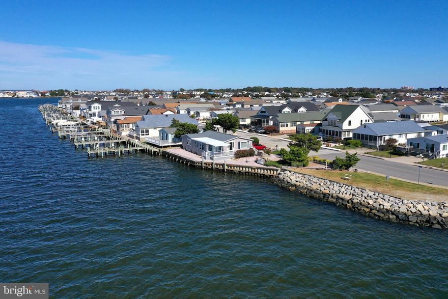 UNIQUE WATERFRONT OVERSIZED LOT & HOME WITH PANORAMIC UNOBSTRUCTED DIRECT BAY VIEWS! This One Of A Kind Property In Montego Bay Features Gorgeous Water Views From Every Direction! DIRECT WATER ACCESS For Fishing & With The Potential To Build Your Personal Dock  For Multiple Boats, PWC, Jet Ski's Or Launching Kayaks & Canoe's. Enjoy Endless Breathtaking Sunsets Of Waterfront Living At It's Finest All Year Long! Whether Your Sitting On Your Side Deck Entertaining Family & Friends Or Relaxing In The Spacious Sunroom, You'll Never Tire Of The Scenic Water Views. One Level Open Living Room & Kitchen W/Spacious Waterfront Master Bedroom & Large Guest Room. Large Windows Throughout Brings Water Views To The Entire Living Area! The Expansive Lot Features A Waterfall W/Pond & Extensive Hardscape For Easy Maintenance. Bulkhead Has Been Replaced Approximately 10 Years Ago.  Community Offers 2 Outdoor Pools, Walking Path, Tennis Courts, Fishing Pier & Miniature Golf All For $396.00 Per Year!