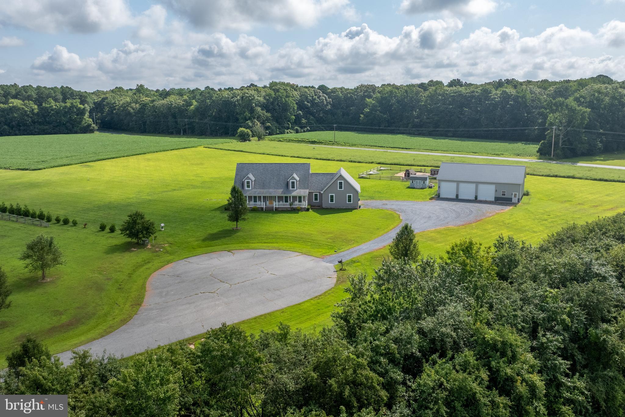 Custom-built Cape Cod on 22.69 acres in the desirable McShell Glenn community! This charming home welcomes you with a full-length front porch and an inviting open floor plan. The gourmet kitchen is a true highlight, featuring stainless steel appliances, a breakfast bar, and a spacious walk-in pantry, seamlessly connecting to the dining room and family room—perfect for entertaining.
The first floor boasts a private primary suite with a luxurious en-suite bath, walk-in closet, personal laundry room, and office. An additional office, second laundry room, and thoughtful layout provide convenience and flexibility. Upstairs, you’ll find a cozy sitting room, two oversized bedrooms, and a full bath. A large unfinished bonus space offers endless possibilities.
In addition to the attached 2-car garage with workspace, this property includes a 30'x60'x14 post-frame building with concrete floors and electric—ideal for hobbies, storage, or a workshop. Outdoor living shines with a brand-new custom paver patio, with plenty of space to add an in-ground pool.
Farmette on over 22 acres where hunting and horses are permitted, this property offers the best of privacy and convenience—just 5 miles from downtown Easton’s shops, dining, schools, and more.