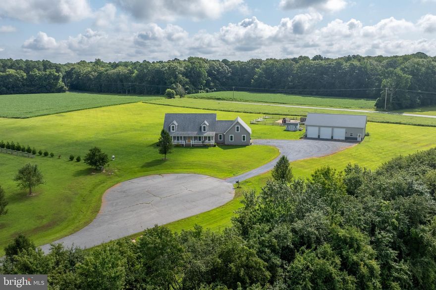 Custom-built Cape Cod on 22.69 acres in the desirable McShell Glenn community! This charming home welcomes you with a full-length front porch and an inviting open floor plan. The gourmet kitchen is a true highlight, featuring stainless steel appliances, a breakfast bar, and a spacious walk-in pantry, seamlessly connecting to the dining room and family room—perfect for entertaining.

The first floor boasts a private primary suite with a luxurious en-suite bath, walk-in closet, personal laundry room, and office. An additional office, second laundry room, and thoughtful layout provide convenience and flexibility. Upstairs, you’ll find a cozy sitting room, two oversized bedrooms, and a full bath. A large unfinished bonus space offers endless possibilities.

In addition to the attached 2-car garage with workspace, this property includes a 30'x60'x14 post-frame building with concrete floors and electric—ideal for hobbies, storage, or a workshop. Outdoor living shines with a brand-new custom paver patio, with plenty of space to add an in-ground pool.

Farmette on over 22 acres where hunting and horses are permitted, this property offers the best of privacy and convenience—just 5 miles from downtown Easton’s shops, dining, schools, and more.