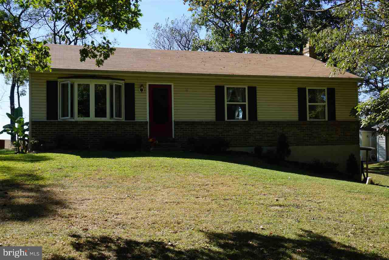 Very quiet, very private Ranch home on wooded lot. Property is surrounded by trees and fields. Property has been redone in the last 3 years. Updated paint and flooring, newer appliances, newer roof. New heat pump with backup, plus wood stove piped into it to circulate heat. Basement ready to be finished with exposed side entrance. 200 amp electric, large 15x18 covered rear patio. New well pump and tank, standard in ground septic system.