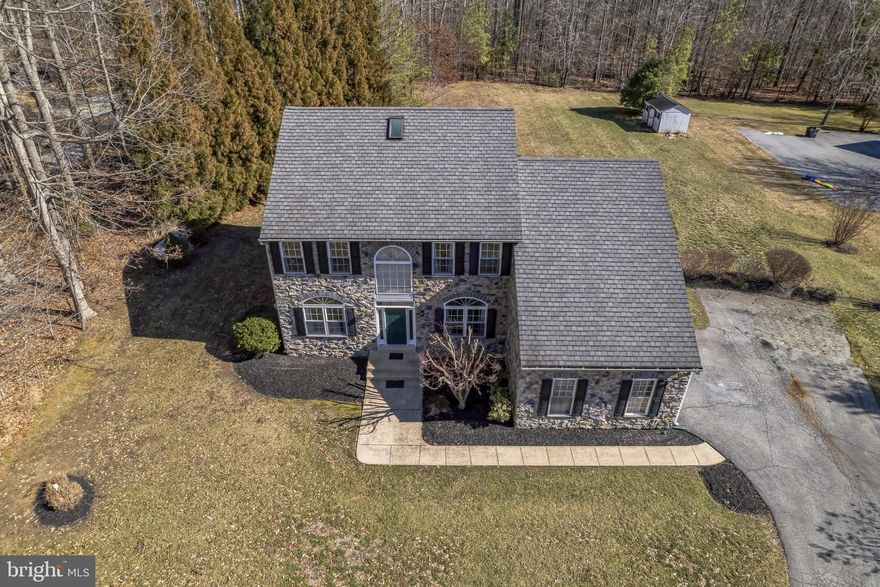 OPEN HOUSE (Sat 4/5/25 11AM-2PM & Sun. 4/6/25 1-3PM) Welcome to 2618 Lady Annes  Way, Located in Castleton one of the most desired Subdivisions in Clavert County.
This amazing property with 4,936 sqft of living space, sits on 1.36 acres with the most spacious and versatile basement providing a plethora of options. Home warranty included. 
As you enter the home on the 1st level into the two-story foyer, formal living room and dining room, open concept family room with gas fireplace and extra large floor to celin windows for an abundance of natural light and beautiful views of the backyard.
The kitchen flows in to the morning room attached to the rear deck.
Rear hallway leads to the laundry room, 1/2 bath and attached 2 car garage. 
First floor primary bedroom with en-suite and walk in closet provides flexibility.
The upper level of the home has 3 additional spacious bedrooms, one full bathroom, linen closet with a front and rear overlook. First and second level has hardwood floors and tile floors in the kitchen, morning room, bathrooms and laundry room.
The basement level has over 1,800 sqft of completed living space and plenty of storage. Two large multi purpose rooms, open family room area, full kitchen with wine chiller / storage and a full bathroom. This space is perfect for extended families and or entertainment. Space can be utilized as in-law suite or entertainment dream, perfect for large family gatherings all year round. 
Backyard has amazing views from the deck, Generac generator system. 
Minutes from hospital, shopping, dining, major commuter routes and top rated schools.
