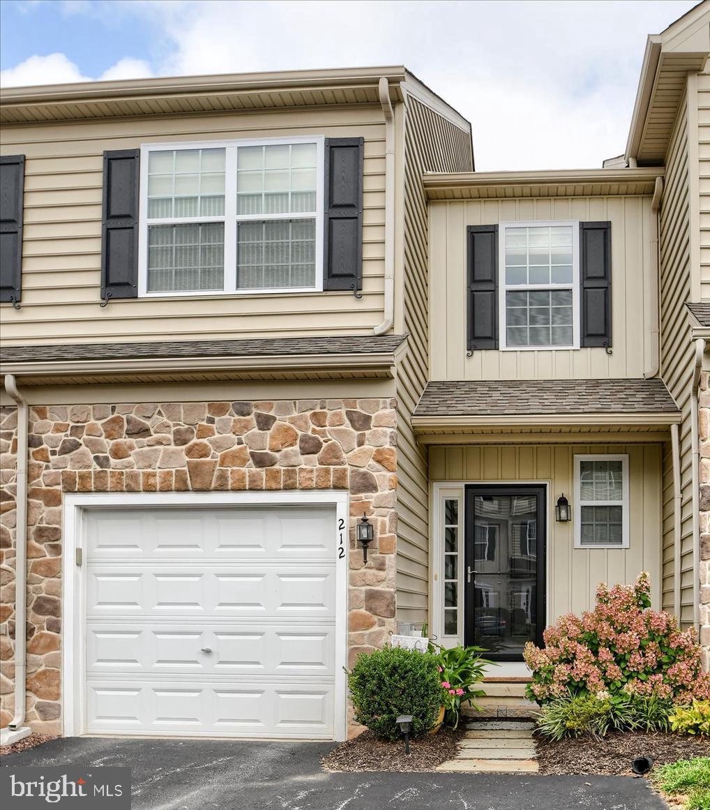 This beautifully maintained townhome offers comfort, style, and functionality throughout. Inside, the main level showcases elegant bamboo flooring, a powder room, and a large coat closet. The spacious eat-in kitchen is a chef’s dream, complete with upgraded granite countertops, stainless steel appliances (including a refrigerator with ice maker), under-counter lighting, tile backsplash, and a center island with seating—perfect for entertaining or casual meals. The living room features a cozy propane fireplace and sliding glass doors that lead to a large composite deck, where you can enjoy your morning coffee and stunning sunset views. Upstairs, the primary bedroom is generously sized with ample closet space. The primary bathroom includes a double granite vanity and a soaking tub, creating a spa-like retreat. Two additional bedrooms offer flexibility for guests or home office space, and a full bathroom and laundry room add convenience. Custom blinds and upgraded light fixtures throughout. Closet systems throughout provide organized storage solutions. The finished basement includes a walk-out sliding glass door, a large window, a closet, and ample storage space, making it perfect for a recreation room, gym, or additional living area. The one-car garage features a poly aspartic coating on the floor, water faucet and storage. So many upgrades throughout this home...it won't last long!