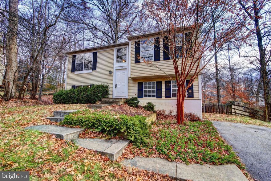 Almost 1700 sq.ft finished; beautiful lot w/mature trees. Close to MARC train station. Fully finished walkout basement & premium backyard with deck & lots of privacy! New high quality vinyl windows. Lower level has full rec room, full bathroom, bedroom and utility room w/laundry. Main level is bright and open, with large picture window in living room, and sliding glass door off KT to rear deck.