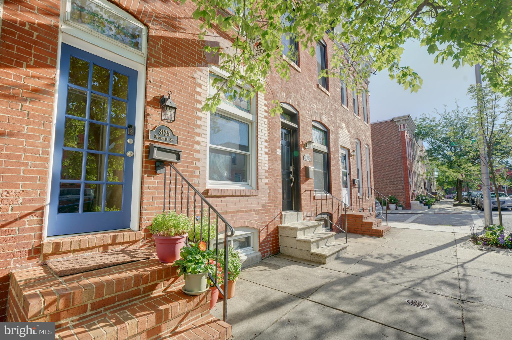 You name it, almost everything is within walking distance to this home!!!! Popular Canton Square, grocery stores, delis, coffee, ice cream, pastry shops, retails stores, gyms, pharmacies, bars, restaurants, barbers, salons and even a library, just a block away. This brickfront rowhome has 2 large bedrooms upstairs with 2 full baths plus formal living and dining rooms, kitchen, laundry and half bath on main level. Walk in thru the double door entry into the living room, featuring original hardwood floors, 2 stained glass transom windows, coat closet and decorative fireplace (officially closed off and currently used for A/V space.) Formal dining room with ample space leading to kitchen in rear of home. Granite countertops, plenty of cabinets, gas cooking, ceramic tile floors and a stone tile backsplash. A 10' rear addition was added in 2018 to include mud room / laundry with half bath on lower level plus extension to master bathroom on upper level. The front bedroom upstairs has 10'+ ceilings with ceiling fan and very large closet with interior lighting. In the rear, the primary bedroom has it's own ductless mini-split HVAC system, lots of overhead lighting and an attached bathroom suite. The bathroom was improved to include designer walk-in shower, tall double vanity sinks with granite counters and custom tile work. Outside amenities include large stone paver patio in rear and a roof top deck on the upper level with both water & city views. Located on an inviting block with overhead string lights coming soon on the entire South side of the block (estimated install is mid July), and steps away from the famous karaoke bar, The Waltz Inn. The first Thursday every month there are concerts by the waterfront and other festivals that go on throughout the year. Enjoy this pet friendly neighborhood and dog park nearby with Bark Social Beer Garden (coming at the end of 2021.) Patterson Park is a short bike ride or walk and is a huge park to play various sports, ride bikes, picnic, or walk/run; also enjoy the dog park with your four legged friend. In the other direction, there is a large sports complex nearby with indoor and outdoor fields that host numerous social sports leagues and a Crossfit gym. Witness fireworks (July 4th, New Years) and fly overs from the Blue Angels Air Show, all visible from the roof top deck, complete with a water view. For commuters, enjoy direct access to 95, 895 and Downtown Baltimore or take the water route via The Baltimore Water Taxi which connects to Historic Fells Point and Locust Point. BJs Wholesale Club and Canton Crossing featuring Harris Teeter, Target, Petco, DSW, Ulta, Nordstrom Rack, and so much more are all short car ride or blocks away from this great location. Plenty of sun in the backyard and roof deck to grow plants and if you own a motorcycle or moped, it can be kept in the rear with potential to park a small car in the rear patio when the rear gates are open. Basement has tons of space to store your bike and storage items. Schedule a tour of this great home today!