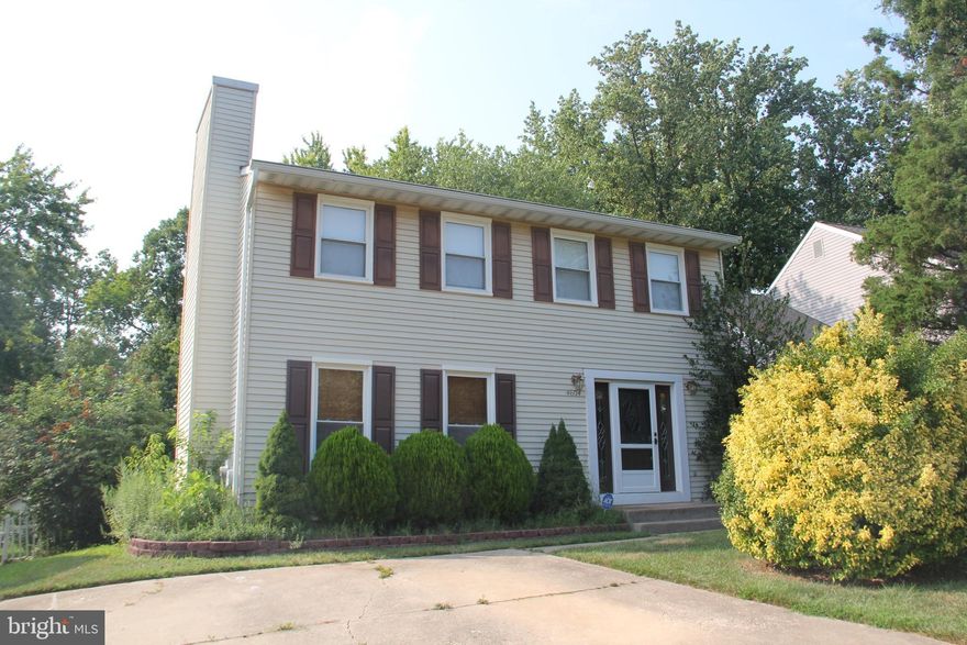 Colonial in desirable Perry Hall.   4 Bedroom,  1 1/2 bath home with living room with fire place and built in shelving, dining room, eat in kitchen and bonus room on the back of the house.   Home backs to woods.  This house needs work, so bring your creativity to make this your own.    Close to Perry Hall Middle and High School, shopping and local parks.