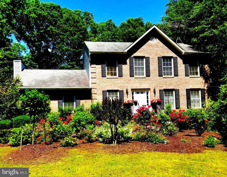 Opportunity to own over 2.5 acres of privacy with a Crownsville address! Short drives to Annapolis, Waugh Chapel, Bowie, Odenton MARC, BWI, Fort Meade. Set back in the woods with wonderful vistas over the deer laden gully to the next ridge.  Brand new roof! New main level HVAC system installed 2 years ago. New water heater installed 2 years ago. New well pressure tank installed 6 months ago. 3-car basement level garage. LARGE open family/great room with high vaulted ceiling connects to open end of eat-in-kitchen. Large deck with encompassing views off of the kitchen  and family room.  Spacious dining room separated from kitchen by a doorway with fantastic forest views out the back. No desire for a dining room? It could make a great home office for 1 or multiple people. Large living room at the front of the house. Powder room off foyer and separated from living/entertaining spaces. Up the foyer stairs to to the right is the large master bedroom with high vaulted ceilings and ensuite master bath featuring dual vanity, soaking tub with a view, and a separate shower. Connecting to the the master bedroom through a door is the second bedroom.  A setup ideal for a nursery or for someone providing home care to a loved one. The master walk-in closet is big, bigger than it appears in the photograph of it empty. The third bedroom is at the back of the house, a good size, and has great views. The basement has a large rec room with lots of natural light coming through 2 sliding glass doors.  The lower level bedroom has a full size window and double closet. There is a ample sized shed in the back yard. Two separate fenced areas in the back yard - one would make a great dog run!  The foliage, flowers, and colors in the Spring, Summer, and Fall are fantastic with an abundance of landscaped, floral plantings! This is an opportunity for someone to live at a great location, on a wonderful piece of land, and make the home their own!