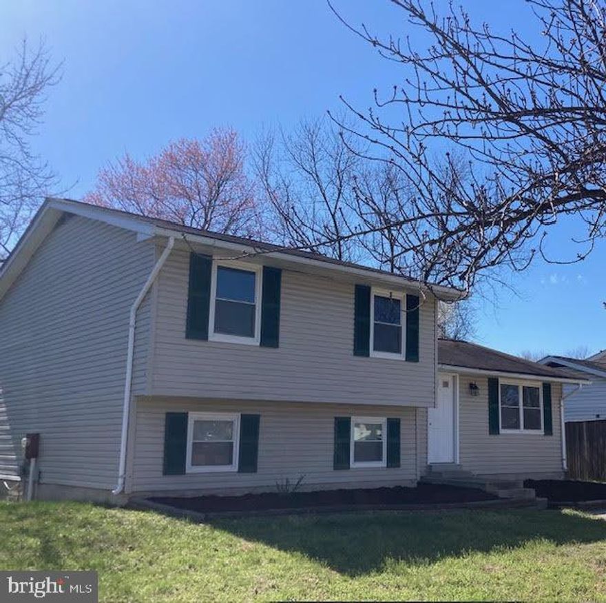 Ready to enjoy living near the water? This 3 bedroom / 2 full bath split level is located within 500 feet of Lake Marion and within 15 miles of the Severn River. All new flooring: carpet and luxury vinyl plank, along with freshly painted walls boasting warm colors throughout.  Primary bedroom with walk-in closet. Deck with sliders off dining room. Lower level with large family room and full bath. Walk-out to an amply sized backyard. Don't miss out on this living opportunity close to all that Severn has to offer!