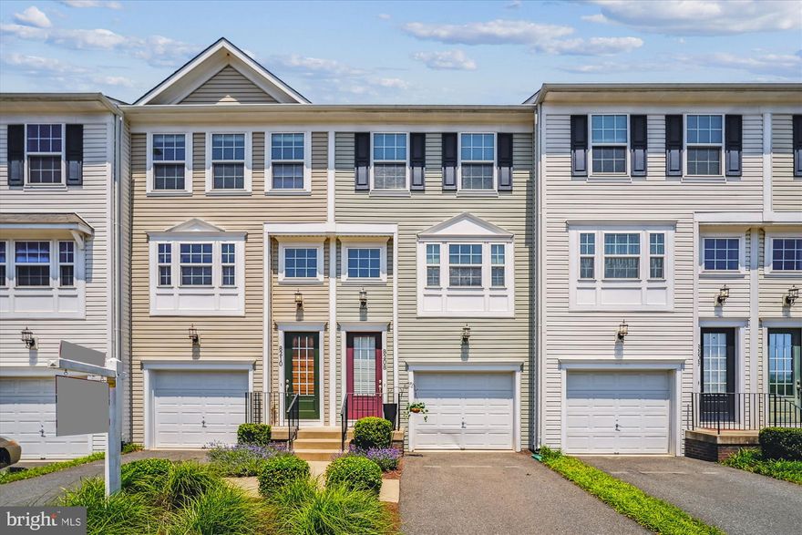Freshly painted with brand-new carpet, this inviting townhome features a one-car garage and a private deck backing to serene woods—perfect for relaxing or entertaining. Ideally situated just off Sudley Road, you’ll enjoy easy access to a wide variety of shopping and dining options, as well as convenient routes to I-66, Prince William Parkway, and the Manassas VRE.

Inside, the gourmet kitchen boasts stainless steel appliances, granite countertops, and a table space flows seamlessly into the bright living area with direct access to the deck and tree-lined views. The main living area also provides a powder room. Upstairs are two generous bedrooms, a full tiled bathroom, and laundry.   

The walkout lower level includes a versatile recreation room, many use as a guest bed with full bathroom #2, and interior access to the garage, making this home as functional as it is comfortable. Community pool, tot lot, and tennis court. Ample visitor parking. Home recently power washed.