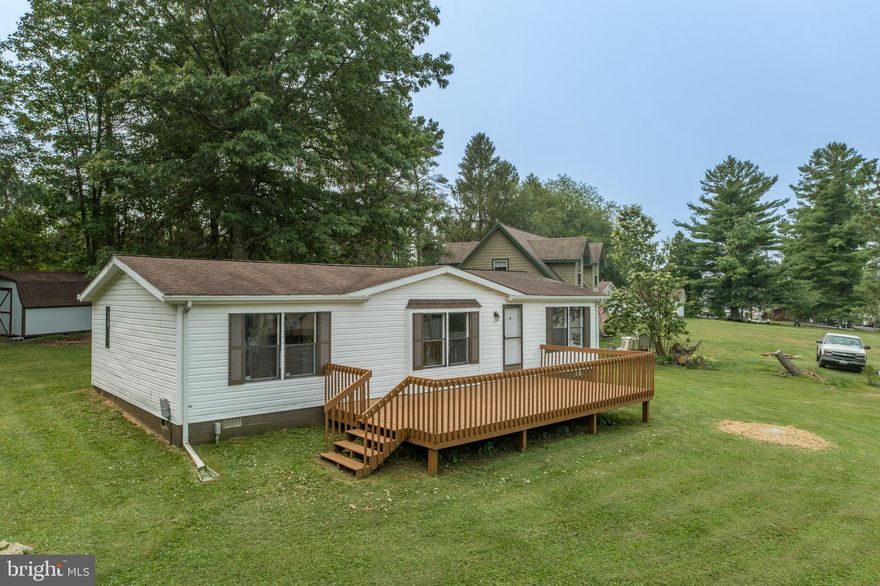 Very well maintained 3 Bedroom 2 Bathroom Ranch style home on corner lot located in the popular Hazelhurst community. Enjoy the Lake Views from the front deck and spacious yard area perfect for family activities. Two storage buildings and all appliances are included.  No HOA and county maintained streets. Call today for your private tour.