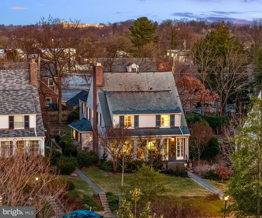 Tucked away on a quiet street yet just moments from the renowned Sherwood Gardens, this Guilford storybook cottage offers the perfect retreat from the hustle and bustle. With a two-story rear addition, it stands as the largest cottage in Guilford, boasting over 3,500 square feet of updated living space, including five bedrooms, 3.5 bathrooms, a home office, multiple sunrooms, and a fully updated kitchen. With its welcoming cottage aesthetic, the interior features spacious yet traditional rooms that create a seamless, practical flow for any lifestyle. The renovated kitchen is bright and airy, with ample counter and storage space. It connects to a functional mudroom, providing plenty of storage for household essentials, shoes, and coats, as well as access to the laundry room. There is also a stunning color drenched half bathroom that was recently remodeled in this area. The dining room brings a touch of mid-century modern style while maintaining the home’s handsome classic character, and just beyond, a cozy solarium with walls of new Pella windows invites in an abundance of natural light. The spacious living room is centered around a cozy wood-burning fireplace with custom built ins and is flanked by dual-sided French doors that lead to a unique glass-enclosed front porch, where you can soak in panoramic views of the surrounding gardens. Upstairs, you’ll find four well-appointed bedrooms, a home office, and two updated bathrooms. The Primary Suite spans the entire third floor, featuring a spacious walk-in closet and a one-of-a-kind en-suite bathroom with original brick accent walls, a soaking tub, a large glass-enclosed shower, and a double vanity. While the basement is currently unfinished, it is fully waterproofed with high ceilings and open space—ideal for storage or a home gym but could be easily finished for additional living space. Outside, the storybook charm extends to the beautifully landscaped .17-acre lot. Offering generous yard space in both the front and back, the current owners have thoughtfully enhanced the property with extensive hardscaping, new grading, exterior French drains, a water garden, and fig and apple trees, creating a lush outdoor retreat. The private, fenced backyard is perfect for children and pets while garden enthusiasts will love the raised vegetable beds, established perennials, and a variety of flowering trees and shrubs that provide year-round curb appeal. Beyond its cosmetic charm, this home has been meticulously maintained and thoughtfully upgraded. Notable improvements over the years include, new HOA approved Cedar shutters, new Pella windows in the sunrooms, an electric car charging station, extensive landscaping and hardscaping, a half bathroom renovation, French drains and waterproofing in the basement, custom built ins in the living room, new electrical and plumbing (2013), partially replaced and fully maintained slate roof, exterior firewood shed with slate roof, chimney restoration, and newer hot water heater and gas stove. In a neighborhood known for its grand historic homes, this rare, move-in-ready Guilford cottage stands out as the perfect blend of charming character, comfort, and modern convenience—offering a storybook setting with all the modern amenities you need to live comfortably.  Want to know more about Guilford? In Guilford you can find the perfect balance of city living but with a more suburban feel. Don't give up your love of culture, dining, shopping and a social life for more space and land- you can have it all in Guilford. There is shopping and dining galore within walking distance. There are numerous parks as well including Sherwood Gardens (1 block away), Linkwood Park and Playground, The Guilford Reservoir Park and Guilford Gateway Park. Enjoy museums? There are plenty in the area. The neighborhood HOA will keep you and your neighbors connected with a number of planned events throughout the year and you are only minutes from John's Hopkins, Union Memorial,