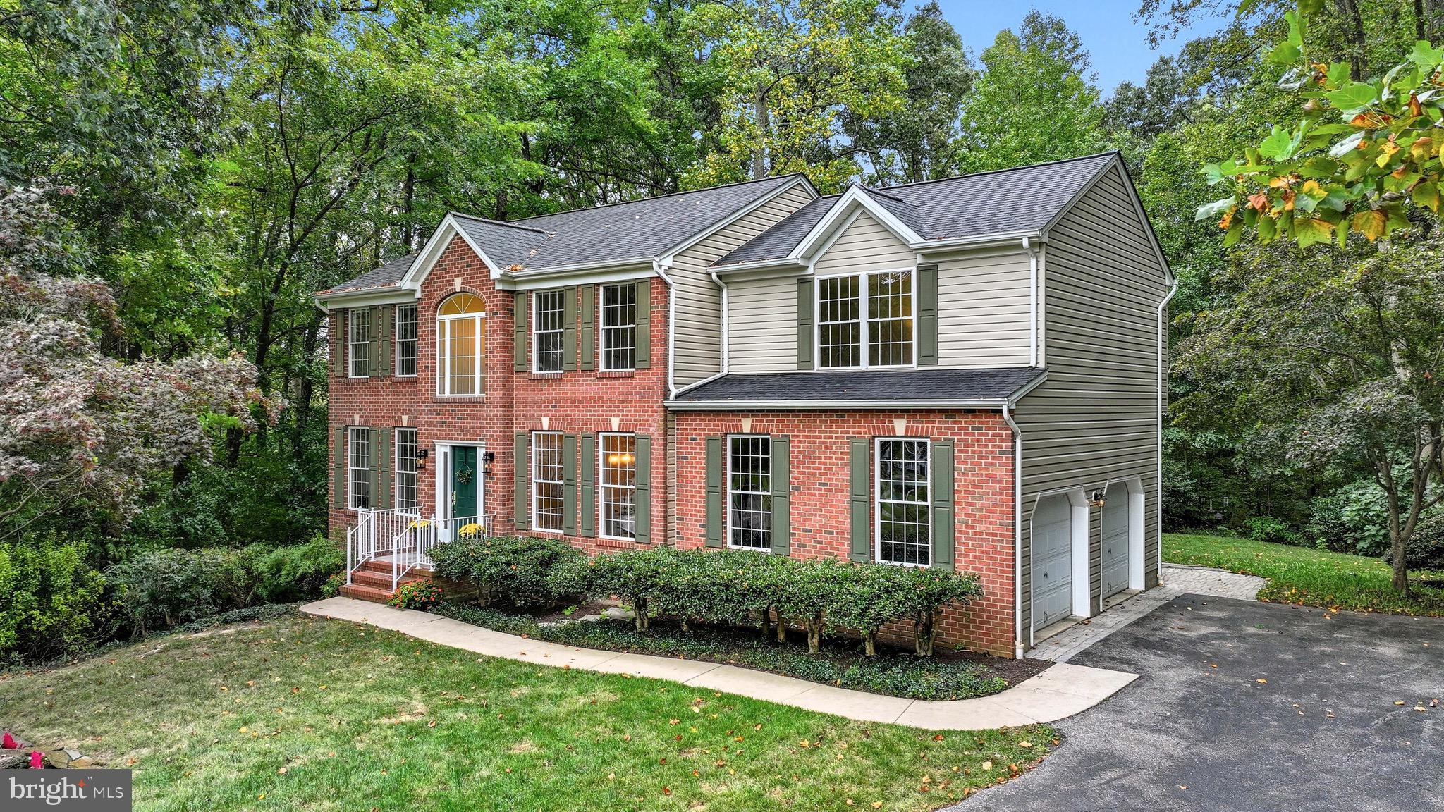 Welcome Home to this charming freshly painted Colonial on Marthas Vineyard Way which offers a perfect blend of classic design and modern upgrades. The spacious kitchen, remodeled in 2006, features Cambria quartz countertops, abundant storage, skylights, and a NEW dishwasher (2022). As you enter the home you will notice the NEW (2025) gleaming hardwood floors plus new lighting throughout. The home has the ultimate open floorplan between the kitchen and family room that is flooded with natural light and french doors that open to a backyard oasis.
Adjacent to the kitchen you will find a separate dining area for those family dinners and holidays. Working from home and need a great home office? There is a separate room off the entrance with glass doors that is perfect for that home office. Upstairs enjoy all NEW carpeting (2025),three oversized bedrooms and an expansive primary suite. Separate his and hers walk-in closets are a plus in the primary suite and cathedral ceilings that give the room a taste of elegance. The primary bathroom has a newly tiled shower, jacuzzi tub, linen closet and double sinks. A separate large laundry room is also on the 2nd level with plenty of storage and convenient for the entire family. The finished basement also has NEW carpet (2025). A fifth bedroom is located in the basement with a full bath, wet bar, walk-out slider and plenty of storage space. This property sits on 2 acres of seclusion and is set back on a quiet Cul de sac. Oversized deck for outside entertainment is just off the family room. A little luxury waits for you with a hot tub on the deck that conveys and a fire pit in the backyard for those cool fall nights. This home is conveniently located with easy access to Washington DC, Baltimore, BWI with plenty of shopping and restaurants minutes away. NEW Roof (2025), HVAC (2008), water heater (2023), new water filtration system (2022), NEW pressure tank for the well (2022) and home generator that conveys.