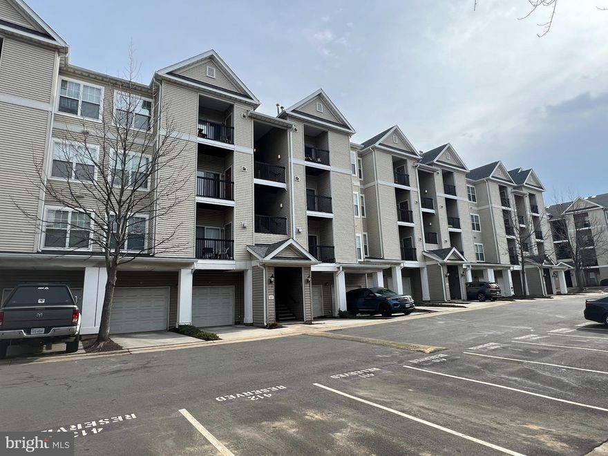 Gorgeous Condo in a Gated Neighborhood, Gourmet Kitchen with Granite Counters, New Appliances, Renovated Bathroom, Hardwood Floors in Living Room, Balcony, Assigned Parking, Convenient Location, and Much More!!
