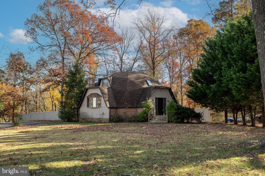 * * * Who doesn't want to start out with a gift?!  The sellers are offering $5000 CREDIT to buyer(s) on this property.  * * *

Experience the perfect blend of architectural charm and waterfront serenity in this one-of-a-kind dome-shaped home nestled on ¾ of an acre with roughly 130  feet of water frontage! This remarkable property offers endless opportunities for relaxation, recreation, and entertaining by the water.

Step inside to discover a bright open-concept layout designed for gatherings, both large and small. The soaring ceilings and skylights with automatic shades fill the home with natural light, creating an inviting atmosphere in the spacious living and dining areas. The modern kitchen features stainless steel appliances, granite countertops, ample storage, and a great flow for hosting family and friends.

With 3 bedrooms and 2 full baths, including a main-level bedroom and full bath, this home is ideal for flexible living arrangements or multi-generational comfort.

The lower level offers an impressive amount of space, currently set up as a dog grooming studio complete with a wash station and individual stalls — a perfect setup for pet lovers, hobbyists, or anyone seeking a home business or workshop space.

Outside, your private retreat awaits — the expansive lot provides plenty of room for outdoor entertaining, gardens, or future enhancements, all set against the tranquil backdrop of the waterfront. Enjoy morning coffee by the shore, launch your kayak, or simply take in the peaceful views that make this home truly special.  The backyard is fenced in with a 6-foot privacy vinyl fence to keep your pets in and away from the water.

Whether you’re seeking a unique primary residence or a weekend escape, this property offers a rare combination of character, functionality, and waterfront living you won’t find anywhere else.