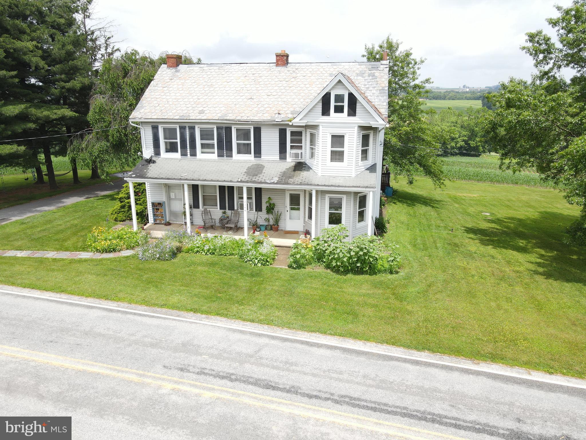 This property will be offered at Public Auction on Friday, September 5, 2025 @ 11am. The listing price is the opening bid only and in no way reflects the final sale price. 10% down due at auction, 2% transfer tax to be paid by the purchaser, real estate taxes prorated. Set amidst the rolling countryside, this beautiful 68.8-acre farm offers panoramic views and abundant agricultural opportunity. Surrounded by Lancaster County farmland, the property features approximately 60 acres of productive tillable ground, a spacious five-bedroom farmhouse, a classic bank barn, and a storage building. The first floor of the home includes a family room, a large eat-in kitchen, a bonus room currently used as a playroom, a bedroom, a full bathroom, and a laundry room. Upstairs, you’ll find four additional bedrooms, a second full bathroom, and an office or storage room. Additional amenities include an unfinished basement and a covered front porch—perfect for enjoying the scenic setting. This farm is preserved and enrolled in Clean & Green. Don’t miss this exceptional opportunity in the heart of Lancaster County.