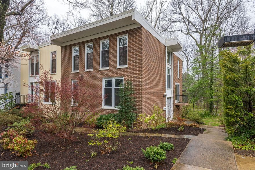 Gorgeous 4BR/3.5BA 2600+ sqft end-unit all-brick townhome w/ 2 parking spots! Gleaming hardwoods! Contemporary open floor plan! Remodeled kitchen & baths w/ maple cabinets & Silestone! Master suite w/ custom walkin closet with Elfa shelving & frameless shower door! Newer floor-to-ceiling windows & sliders! Walk-out lower level to rear deck - perfect for entertaining! Assigned parking & covered carport! Minutes to RTC & Lake Anne Plaza! Only 1.5 miles to METRO!