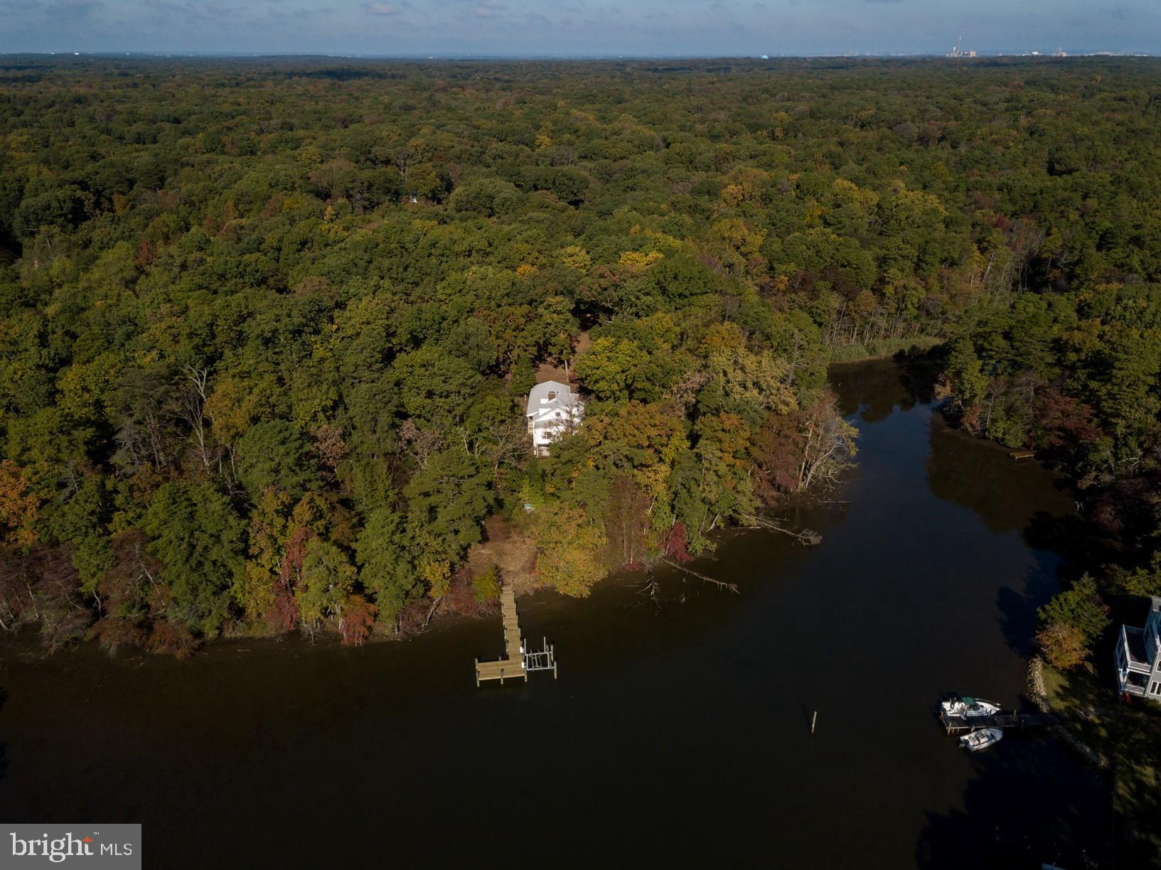 Secluded 5 Acre Waterfront 3 Bedroom 3 Full Bath Cape Cod located in Chesapeake School District, Private setting overlooking Black Hole Creek off of the Magothy River. Property is located on a point so you have scenic water views on on approx 250ft of water frontage. Newly re-decked pier with electric boat lift. and more. Newer HVAC System with Heat Pump. This is a Great Value for a 5 acre waterfront location!Home being sold in AS-IS Condition but all major components are in good operating condition.