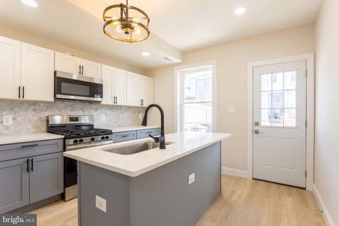 Photo of 321 S Macon Street, BALTIMORE, MD 21224 (MLS # MDBA2194582)