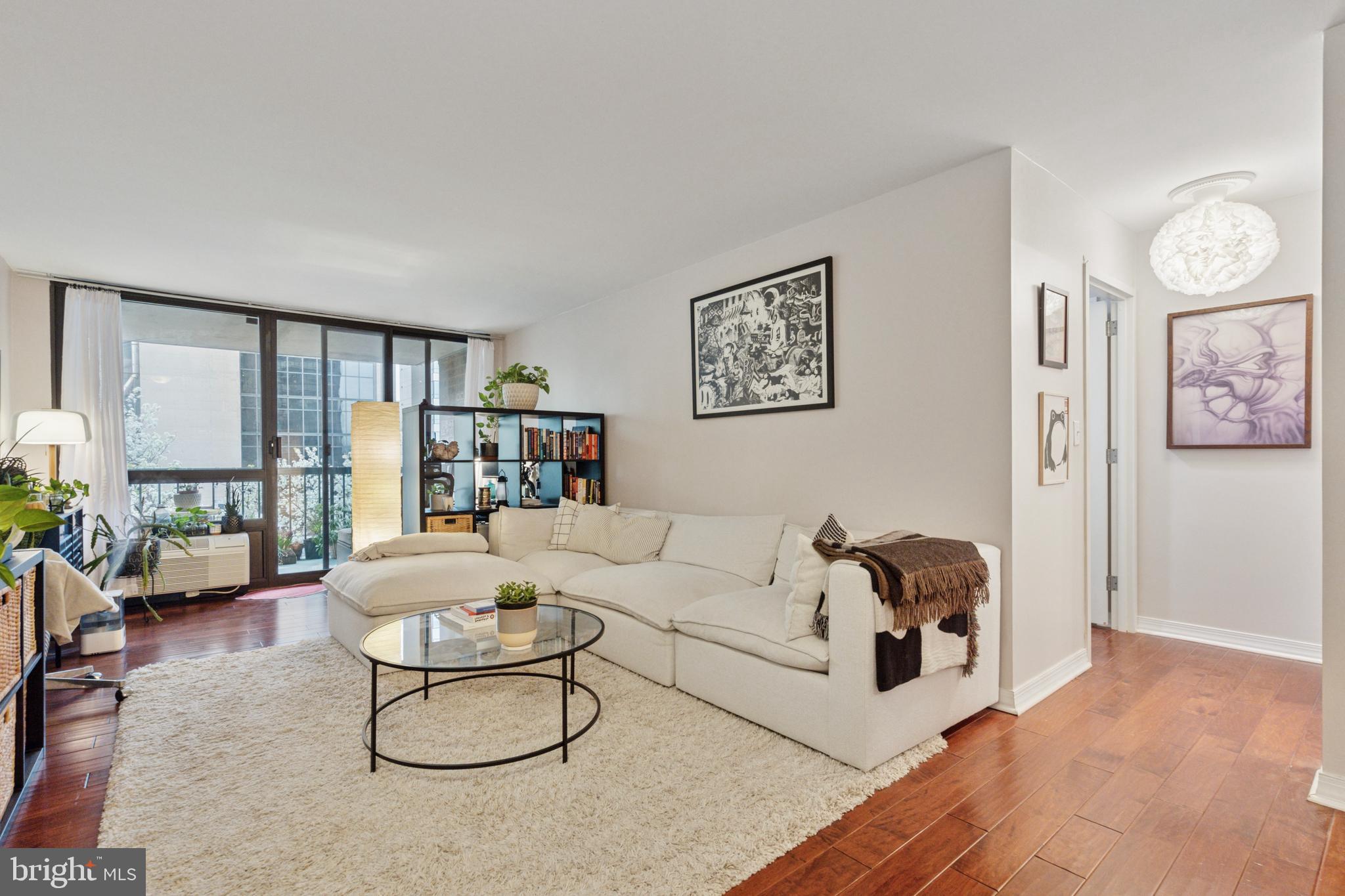 Enjoy convenient city living from this oversized one bedroom, one bath condominium with a private balcony featuring treetop views! Offered either furnished or unfurnished, this home showcases a graciously proportioned open living/dining space with a wall of windows and beautiful hardwood floors. The kitchen with breakfast bar is fully-equipped with granite counters, dishwasher, range, microwave, refrigerator, and good cabinet space. The bedroom is spacious and features great storage, including a walk-in closet. A tiled bath off the hall, and a large laundry/utility/storage room by the foyer, complete this lovely home. Independence Place is an elegant established building with a gorgeous new lobby, 24 hr front desk, state of the art fitness center, on-site management, and direct access to a public parking garage (parking subject to availability and an additional monthly fee). Perfectly located on the southeast corner of Washington Square, this home is steps away from the best of Philly's dining and retail scene, world-class museums and historic attractions, and is convenient to public and mass transit, Jefferson University, Pennsylvania Hospital, and more!